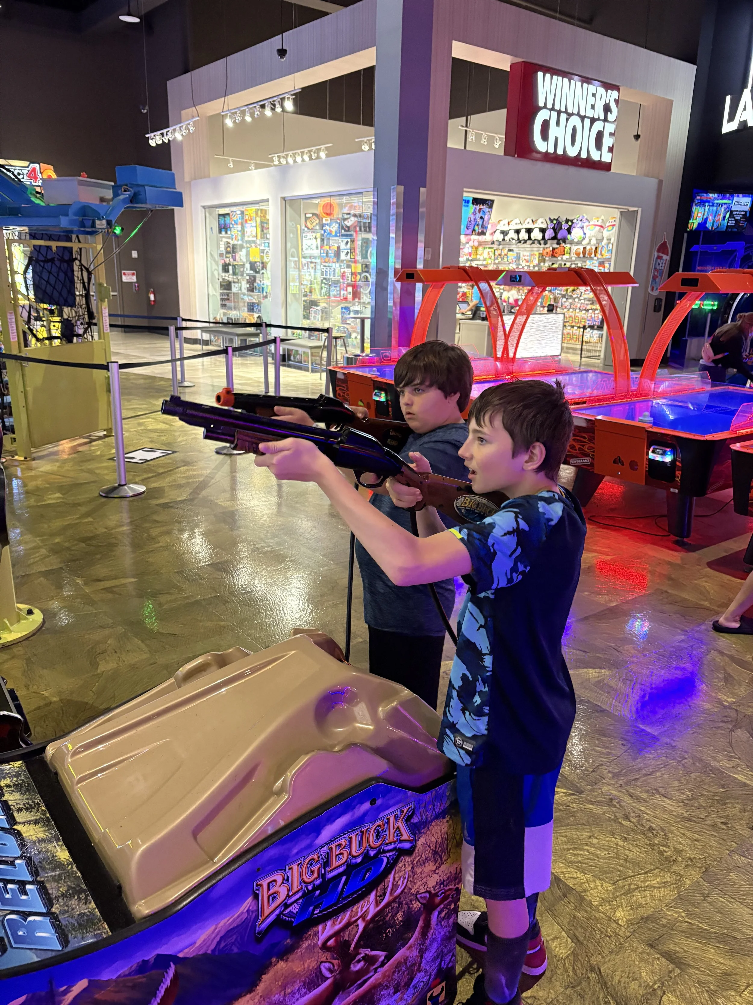 Redeemer Lutheran Church Kansas City youth group having fun at Main Event, highlighting vibrant youth ministry programs in the KC area.