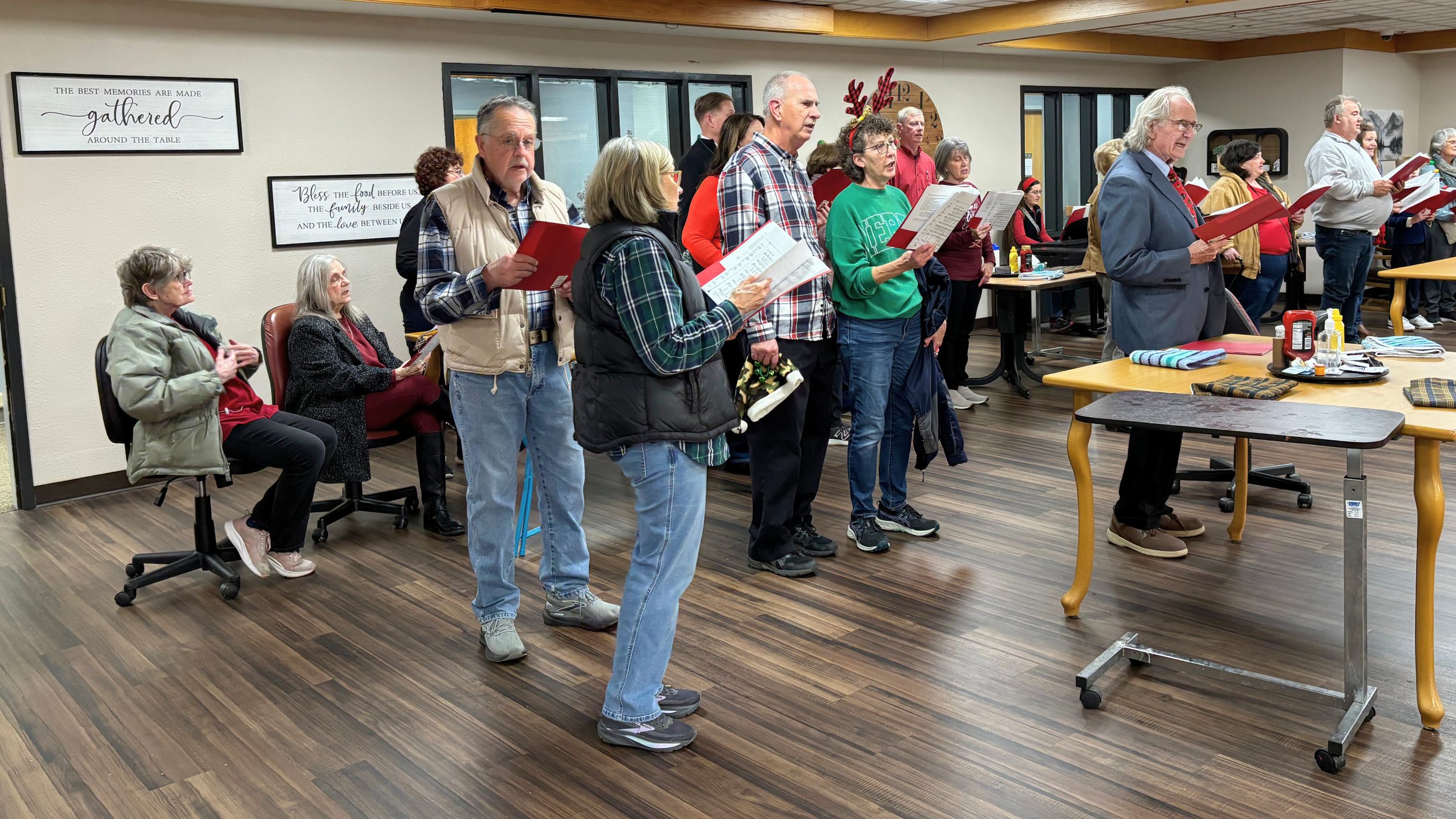 Redeemer Lutheran Church carolers singing for longtime church members at a local nursing home, sharing the joy of Christmas and spreading holiday cheer.