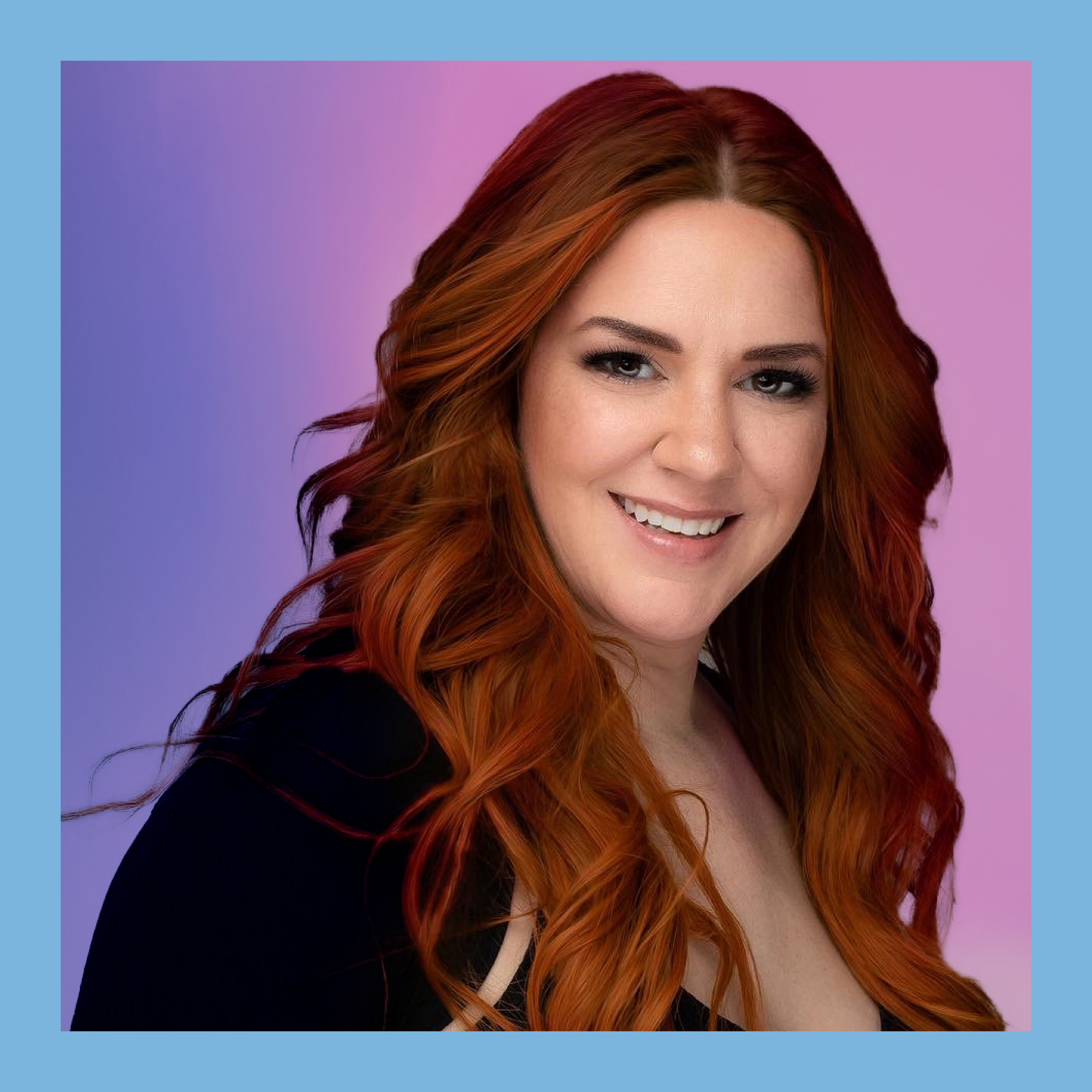 Close-up of a woman with long, wavy red hair and blue eyes, smiling, against a gradient purple and pink background.