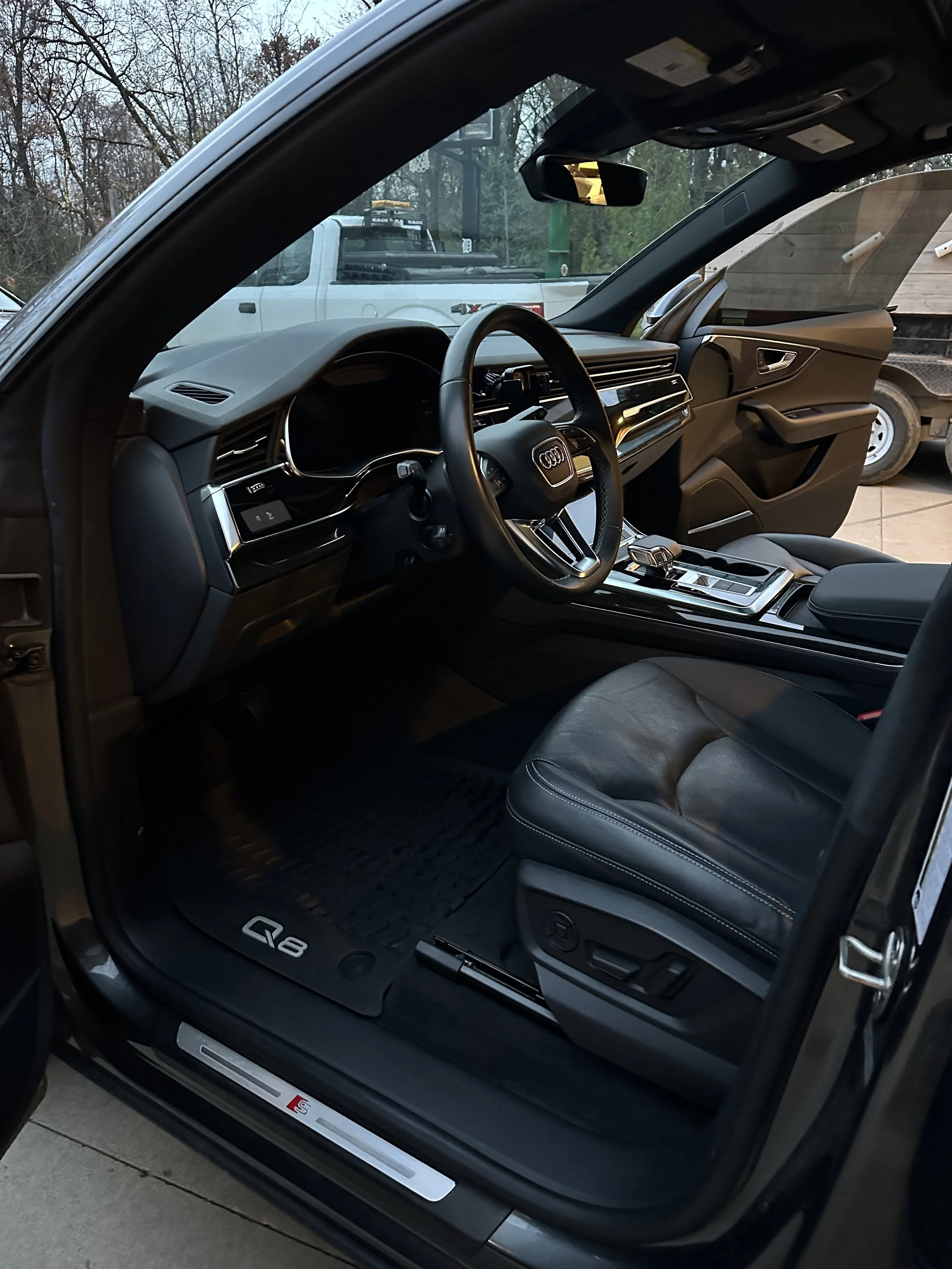 Luxury Audi Q8 interior detail featuring rejuvenated leather seats, polished trim, and meticulously cleaned surfaces. Premium European vehicle detailing for a clean, upscale finish.