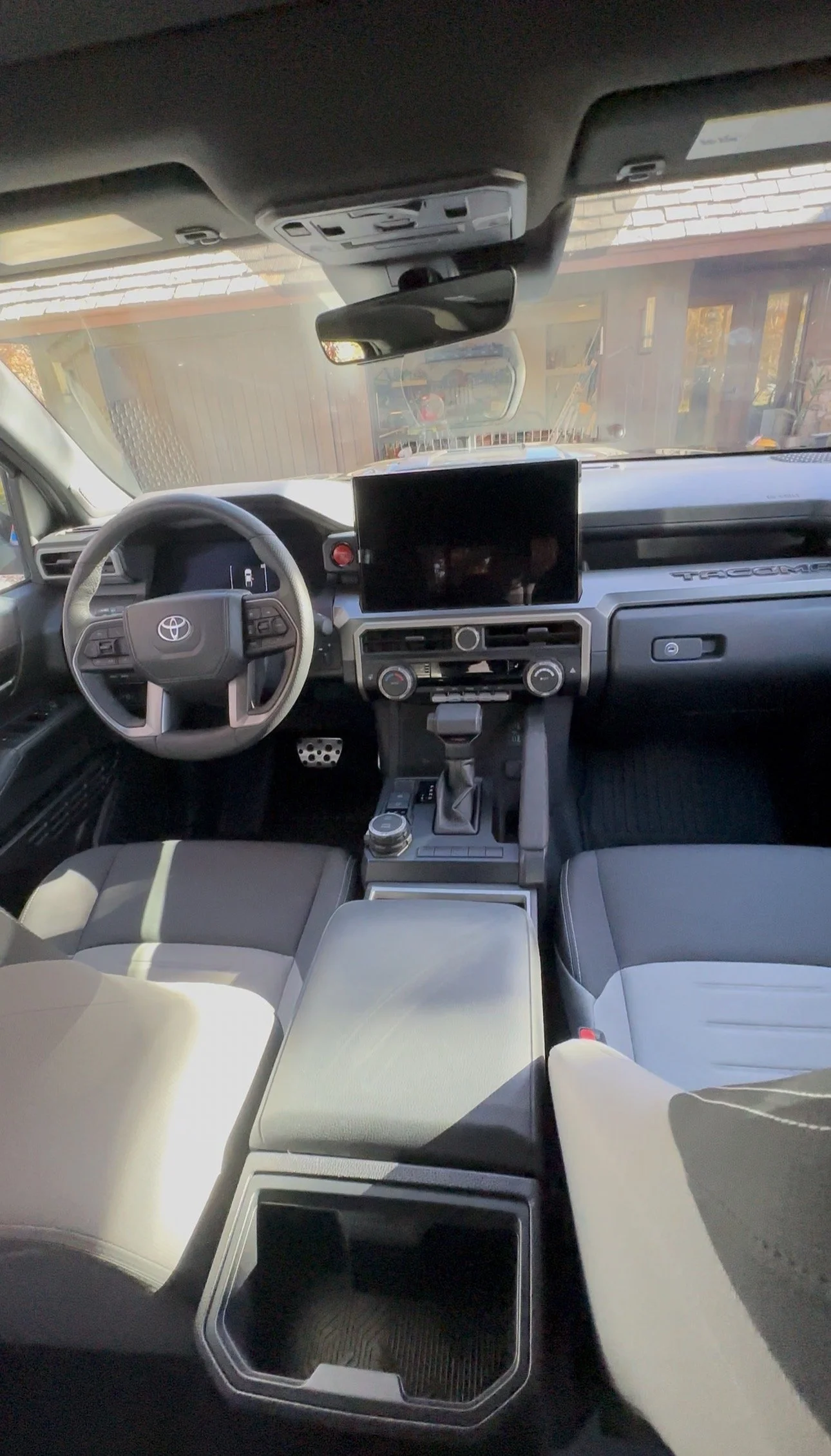 Professional interior detail on a Toyota Tacoma with cleaned upholstery, sanitized touchpoints, dust-free dashboard, and restored center console. High-quality truck interior detailing for a like-new feel.