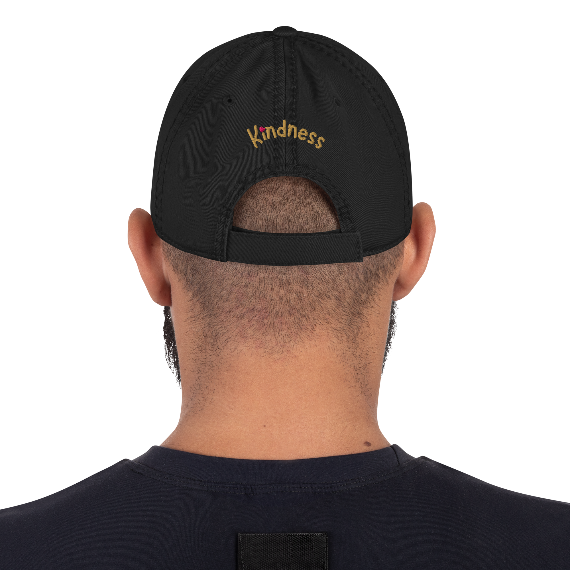 Black distressed dad hat — on-model back view, “Kindness” embroidery.