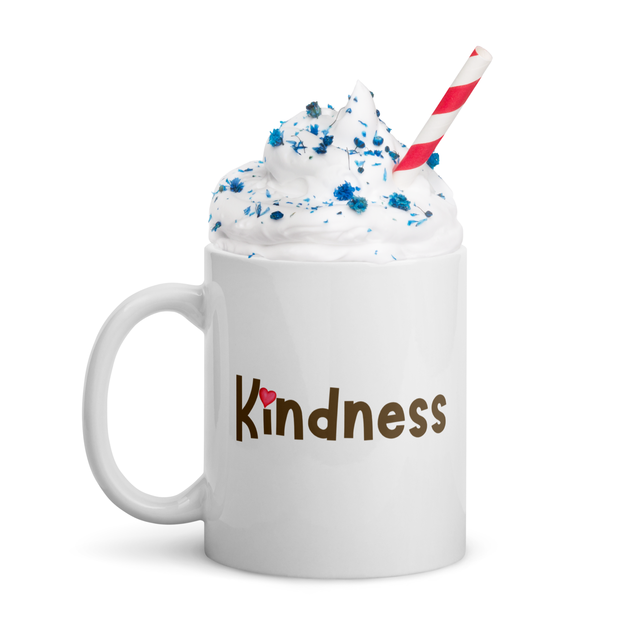 White mug with whipped cream and straw, featuring “Kindness” wordmark with heart over the i.