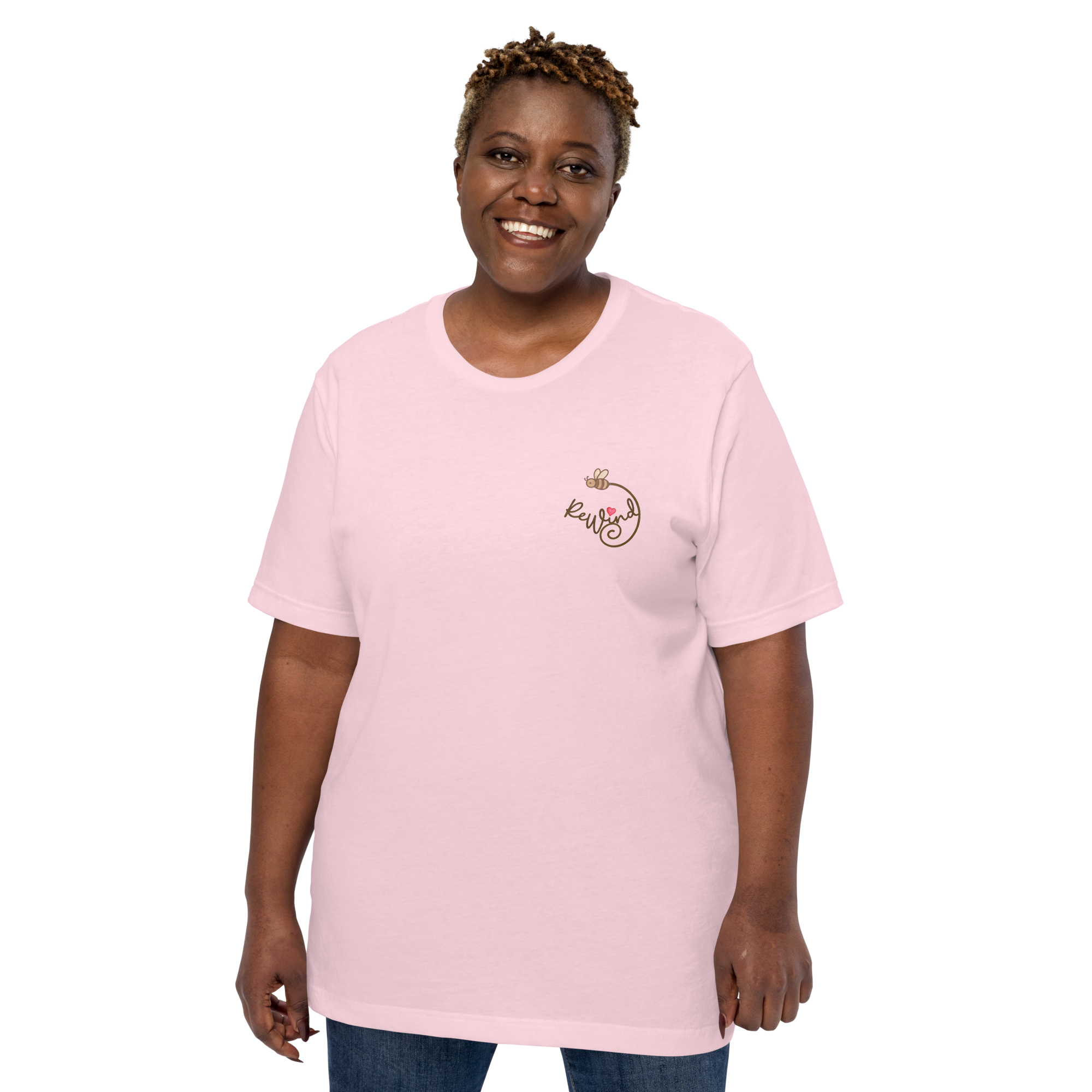Unisex t-shirt, soft pink, model front view — front with ReWind bee-and-heart logo and back with “Kindness” text (heart over the i).