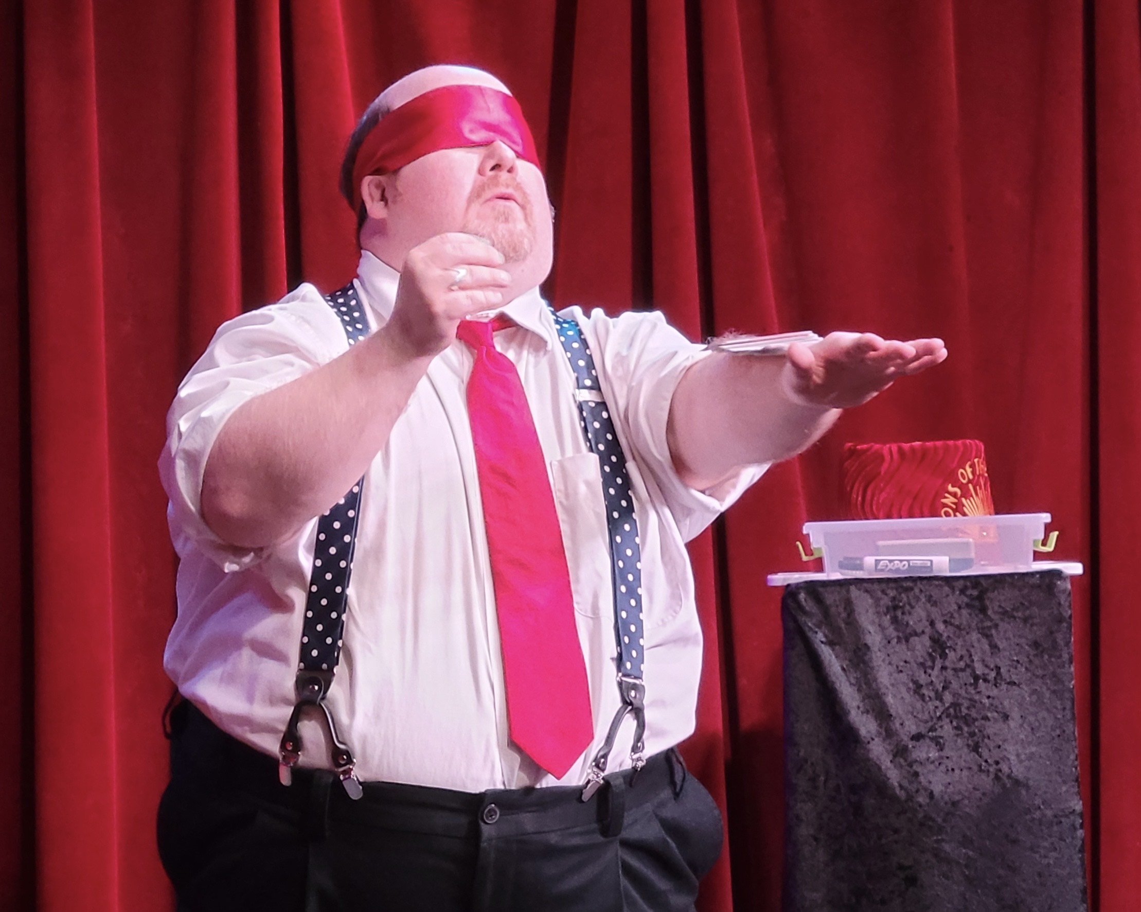 Sir Pat-trick performing magic trick at local theater