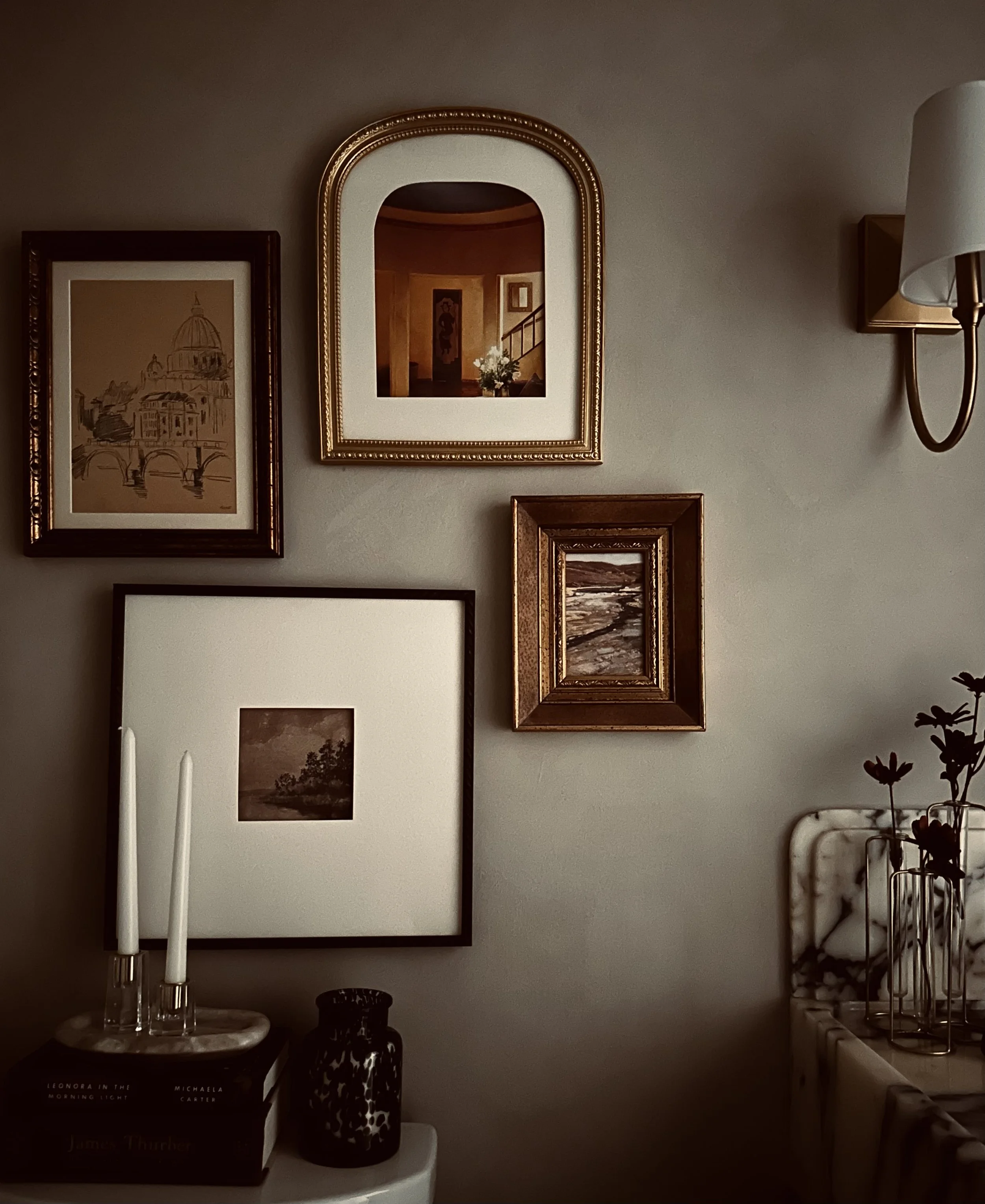 Moody organic washroom bathroom remodel, interior design, gallery wall, vintage artwork, calacatta violi custom vanity, candle sticks bathroom decor, styling