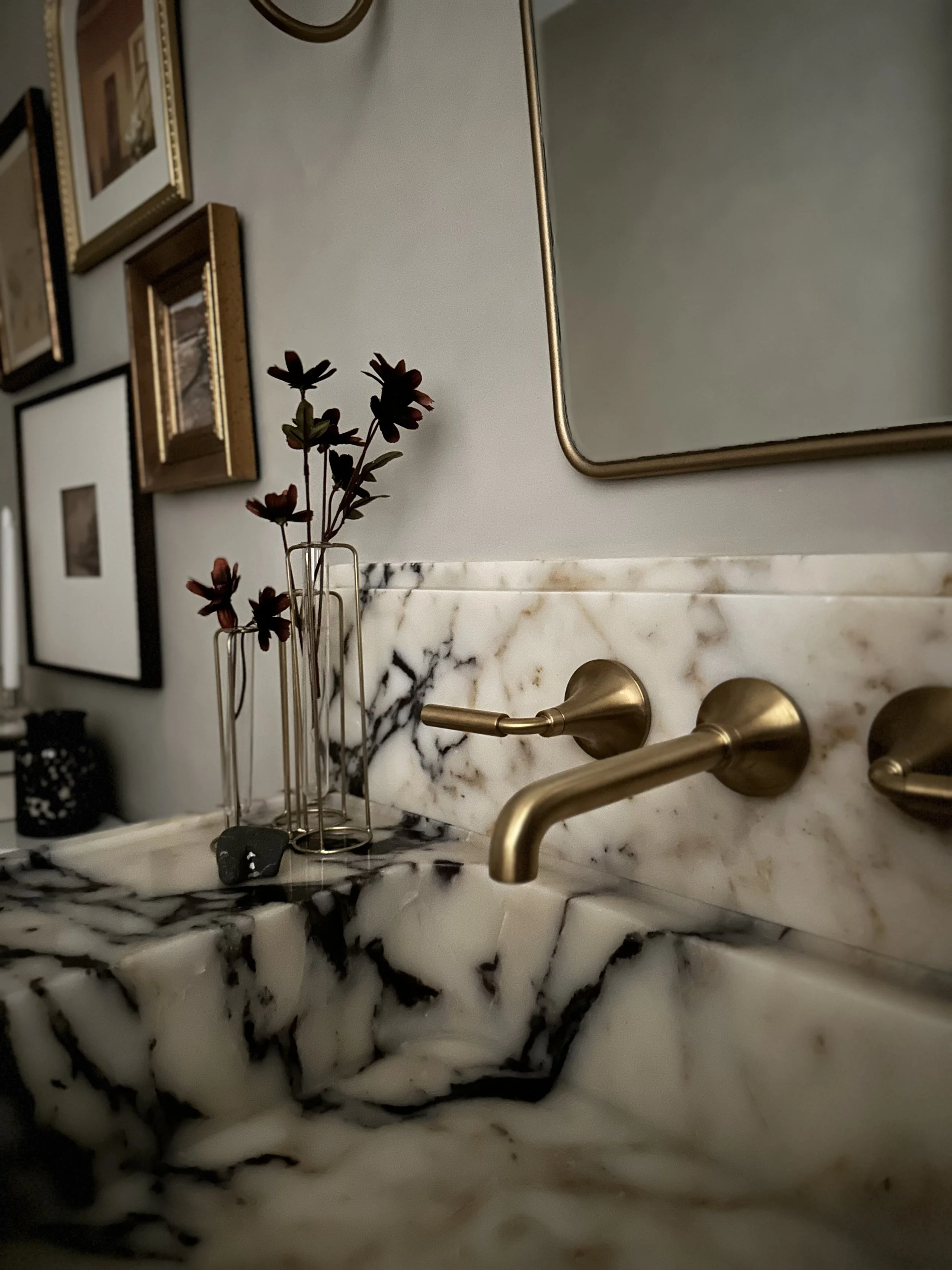 moody modern organic bathroom, bathroom remodel, home renovation, interior design, calacatta violi marble custom sink vanity, brass wall mounted faucet, vintage florals, gold vanity mirror, bathroom vintage wall art, gallery wall, bathroom decor 