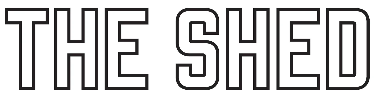 Text saying 'THE SHED' in black outlined letters.
