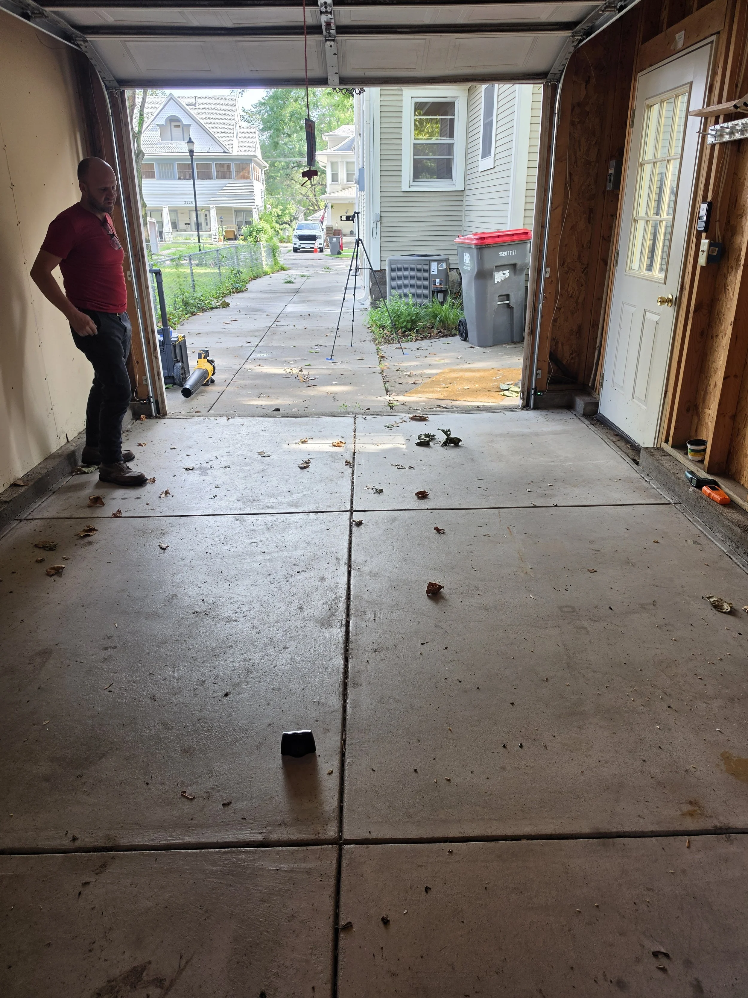 Residential garage concrete floor before coating installation by Forge Surfaces
