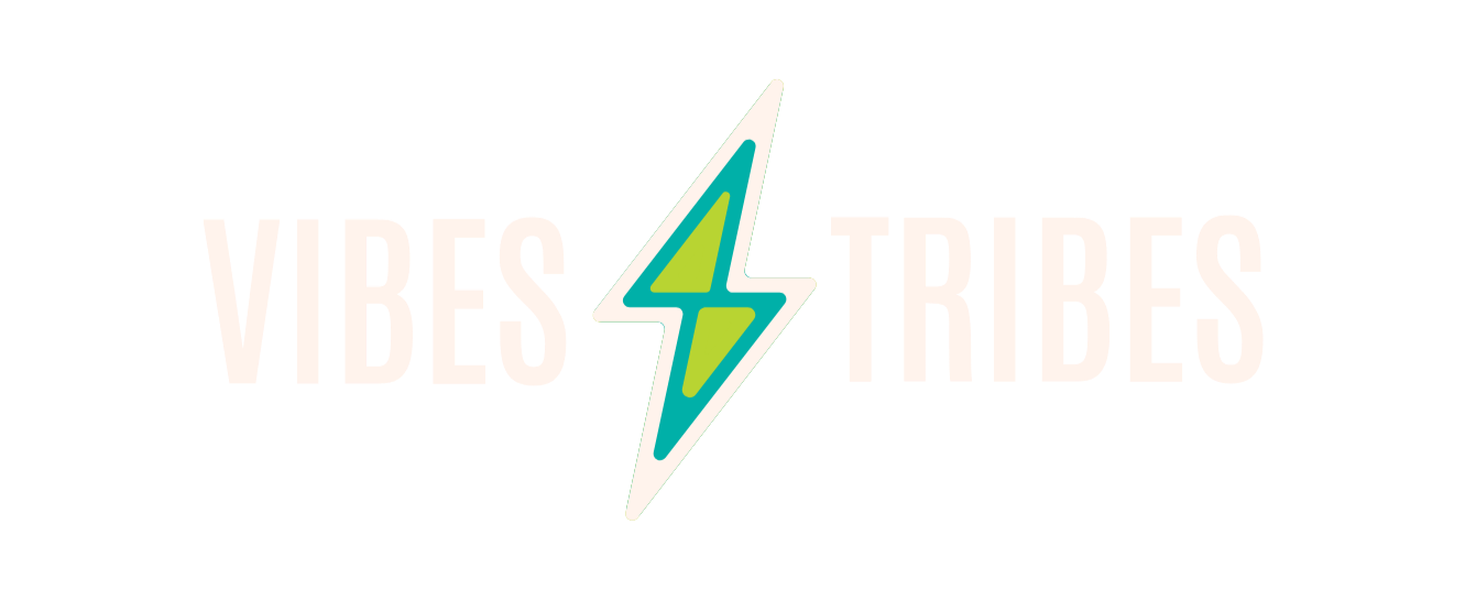 Vibes and Tribes logo with a stylized lightning bolt in the center, colored in green and blue, on a black background.