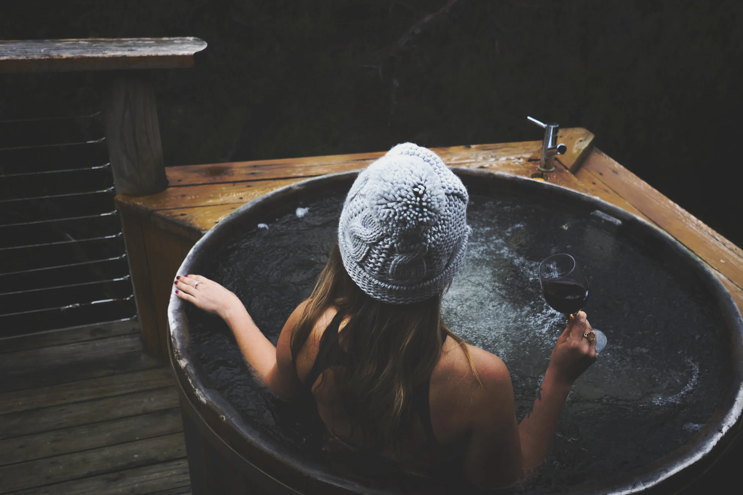 Cradle Mountain Attractions | Cradle Mountain Transfers | Lady sitting in hot tub