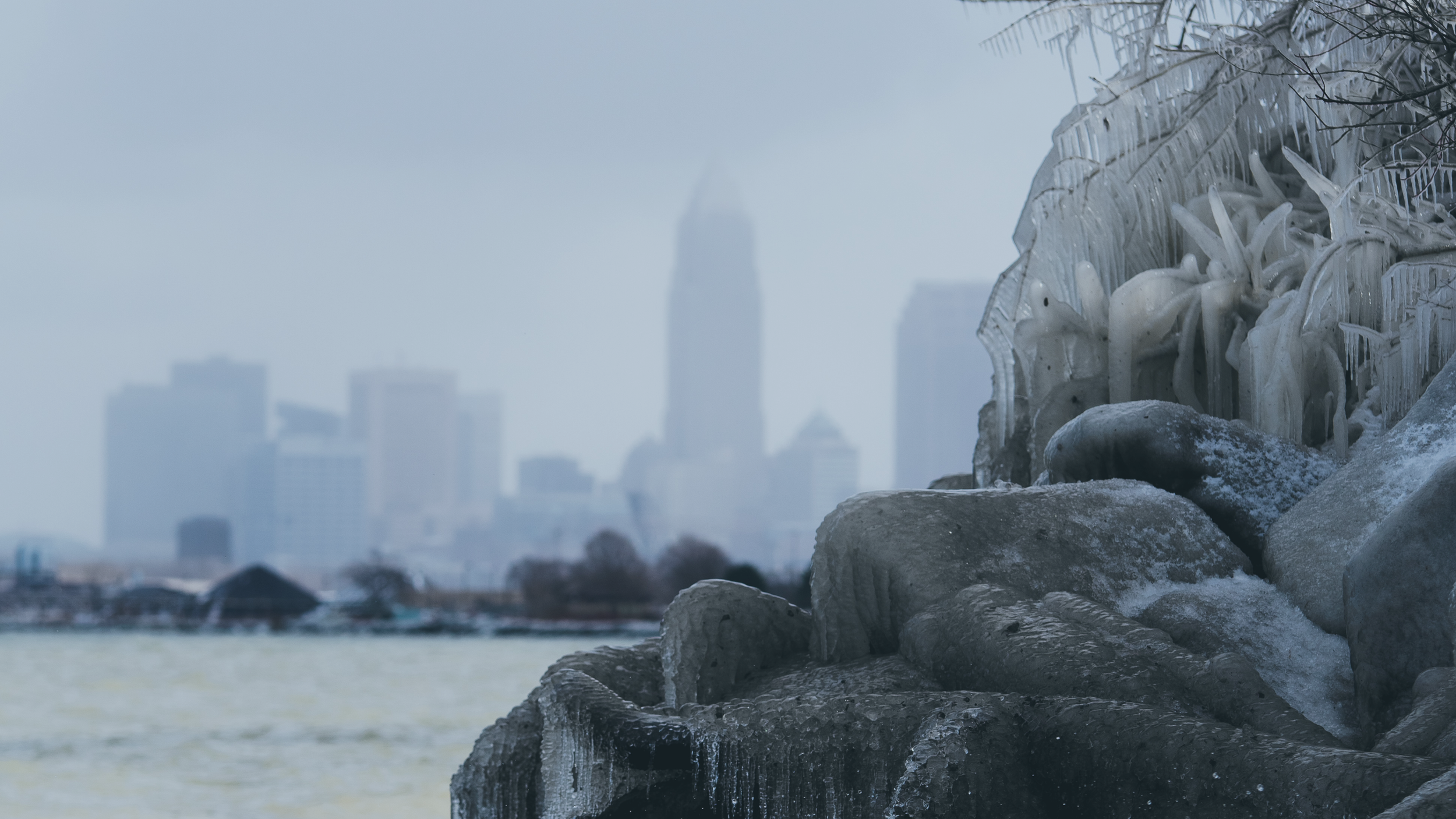 snow capped Lake Erie with the Cleveland skyline in the background