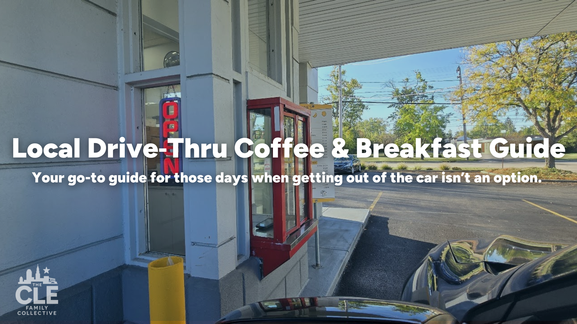 Drive-thru coffee and breakfast restaurant with a red phone booth-style menu stand outside, a yellow trash bin, and a view of a parking lot with trees in the background.
