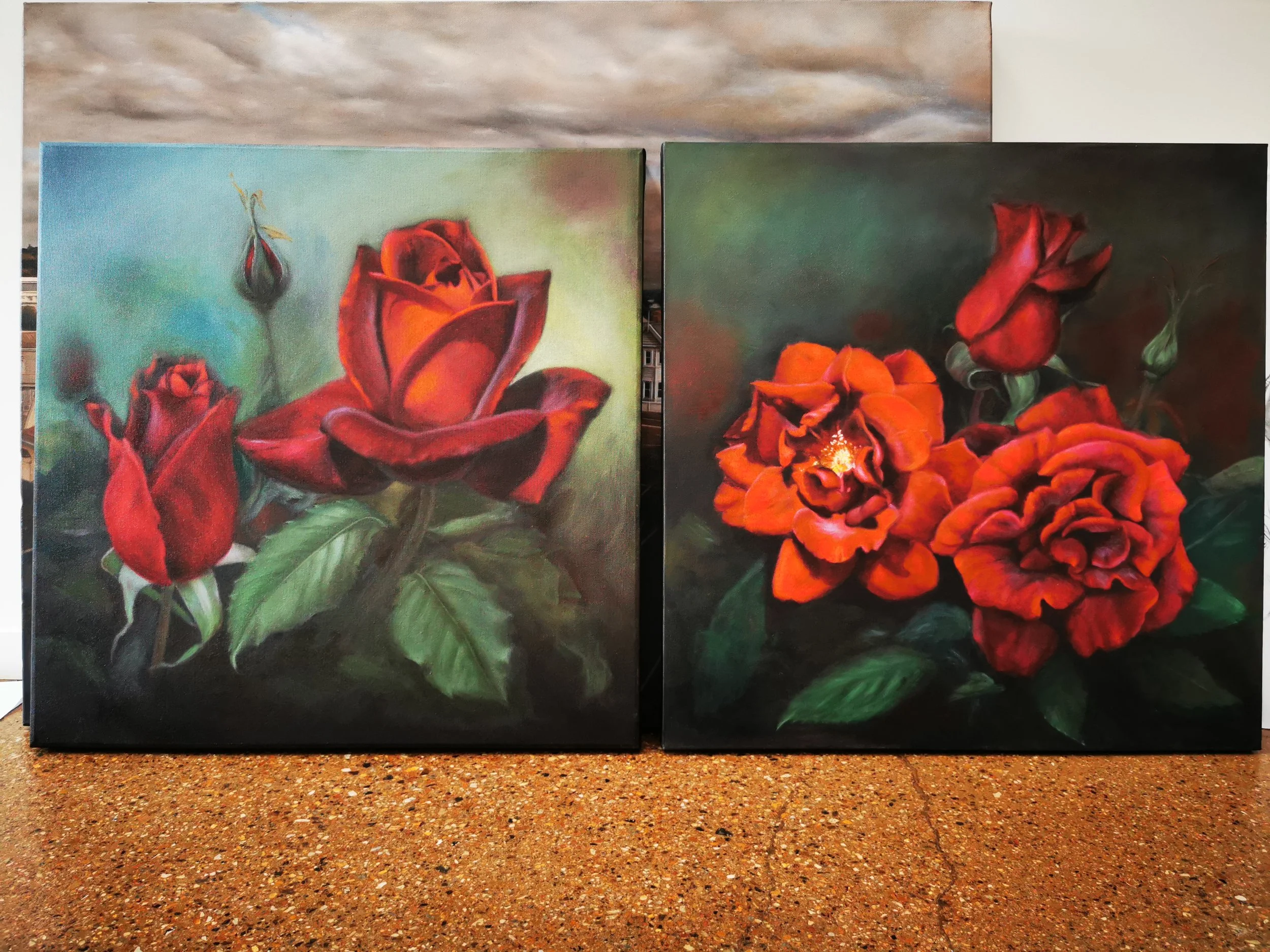 Two paintings of red roses with green leaves on a brown and dark background.