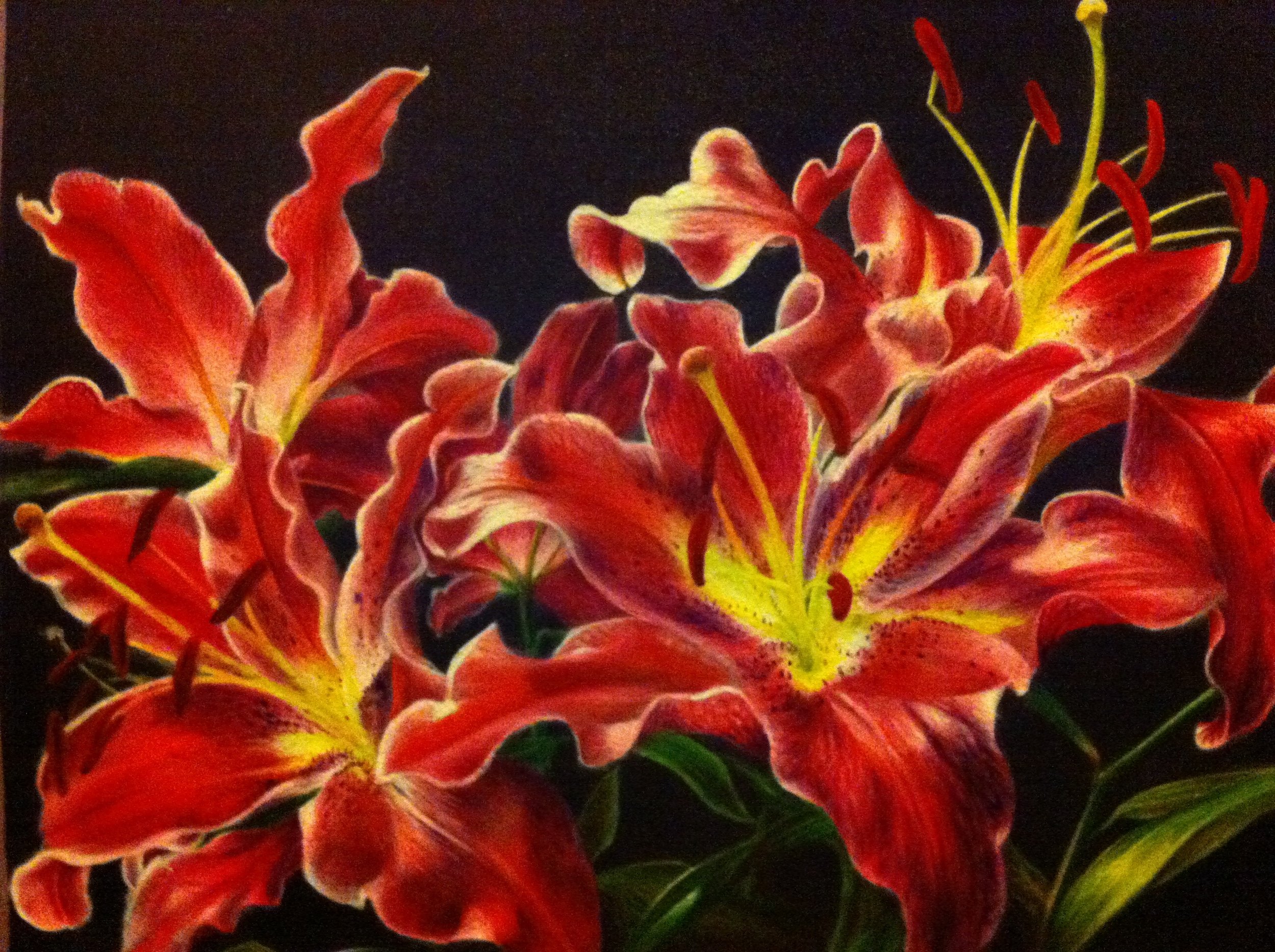 Close-up of vibrant orange and yellow lilies with dark background.