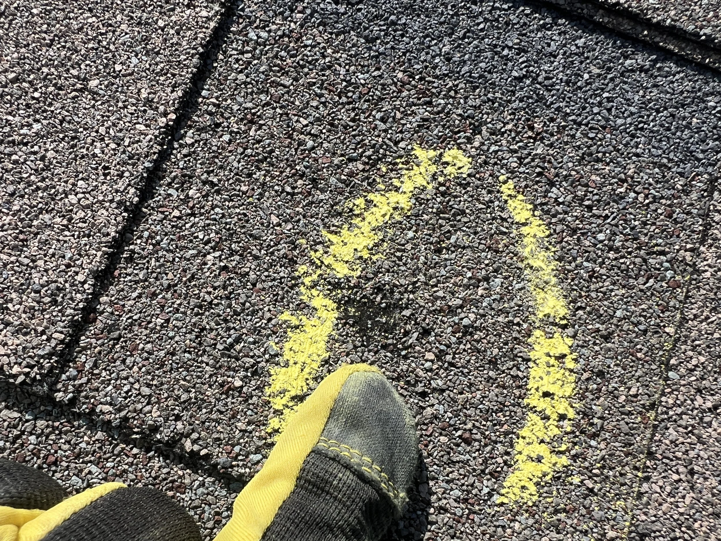 Hail damage to a roofing shingle