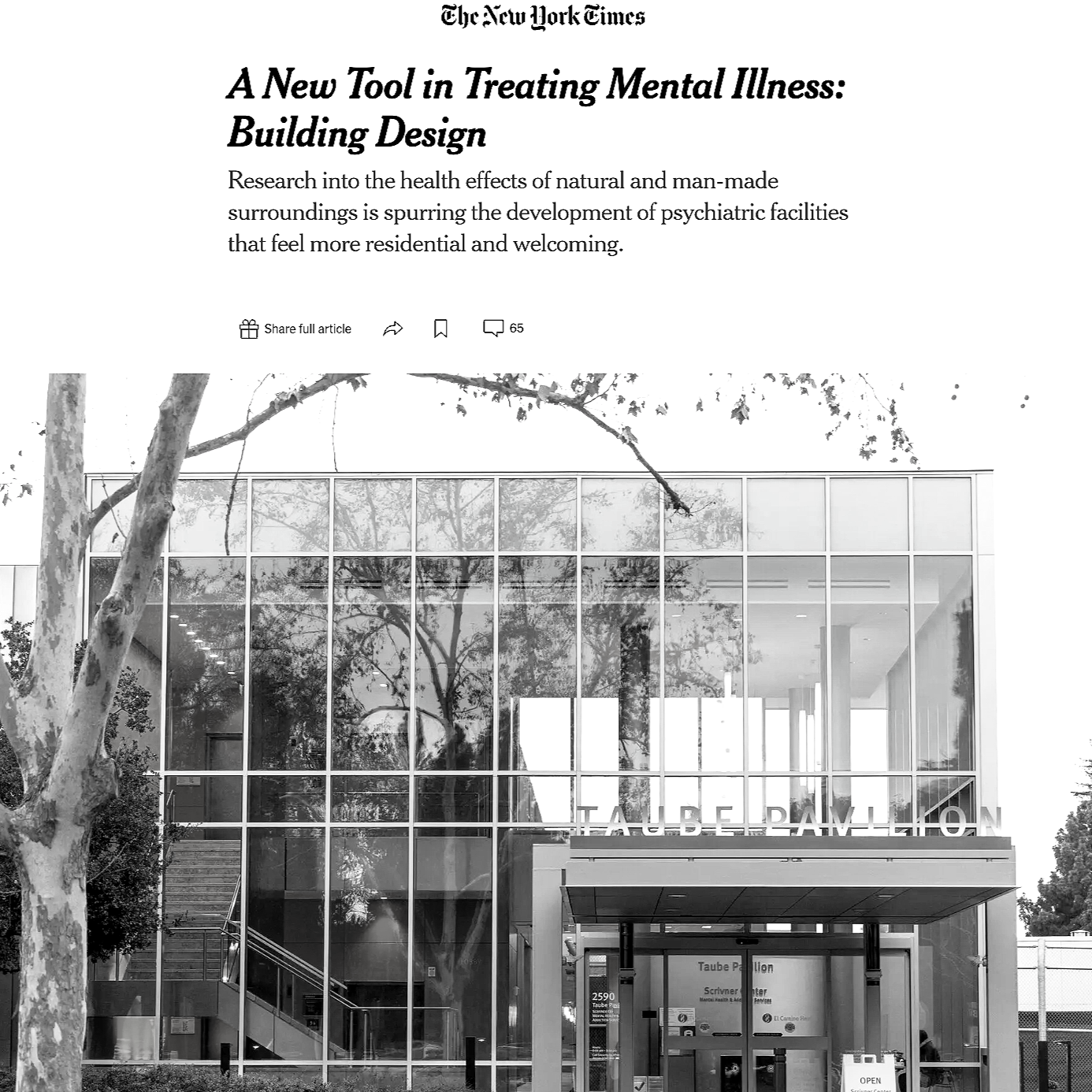 A black and white photo of a modern building with large glass windows reflecting trees outside. The building has an entrance with a sign that reads 'Taube Pavilion'.