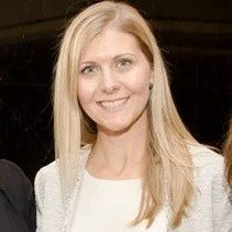 Woman posing with long blonde hair smiling 