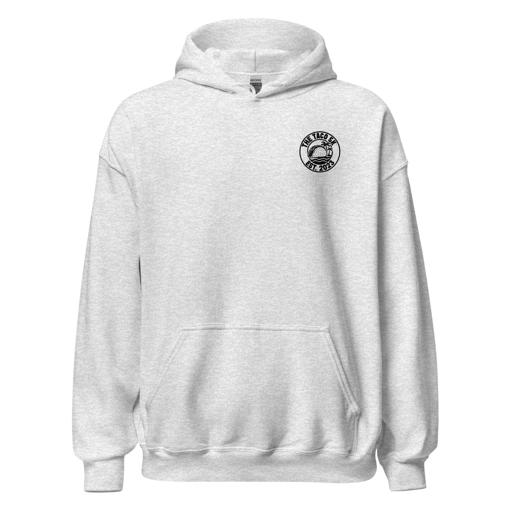 A light gray hoodie with a circular logo on the left chest reading "THE TACO SKA EST. 2023" with a taco illustration and palm trees.