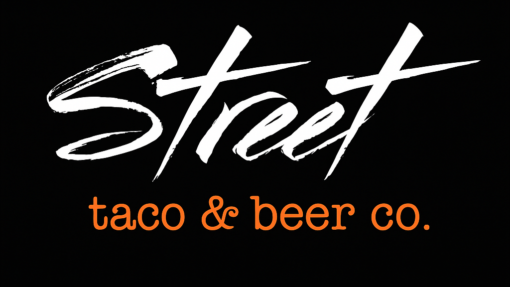 Logo for Street Taco & Beer Co. with the word 'Street' in large, white, distressed script and 'taco & beer co.' in smaller, orange, lowercase letters on a black background.