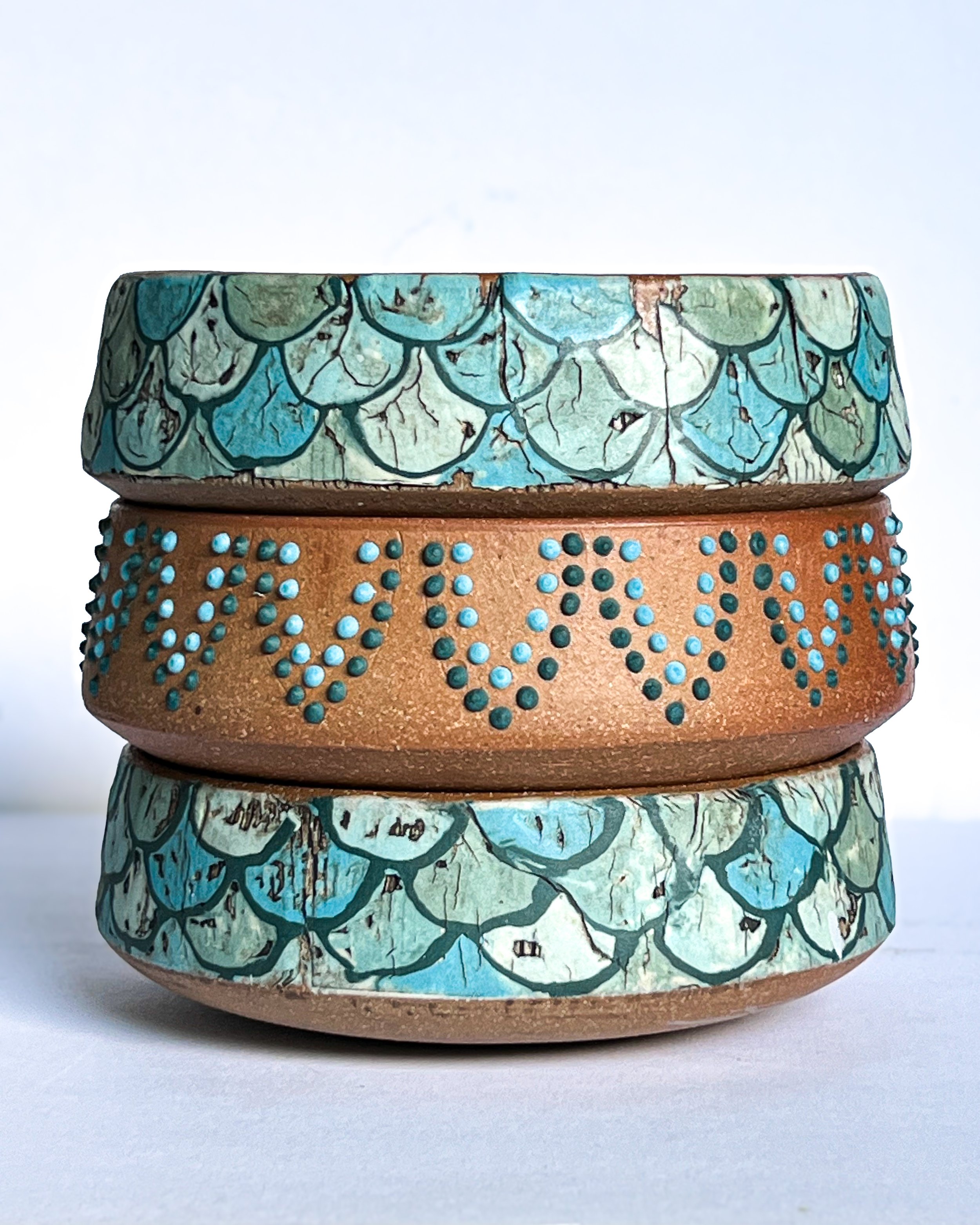 During my Diploma of Ceramics I made a series of wheel thrown bowls. Coloured slip transfer was my decoration choice for these bowls.