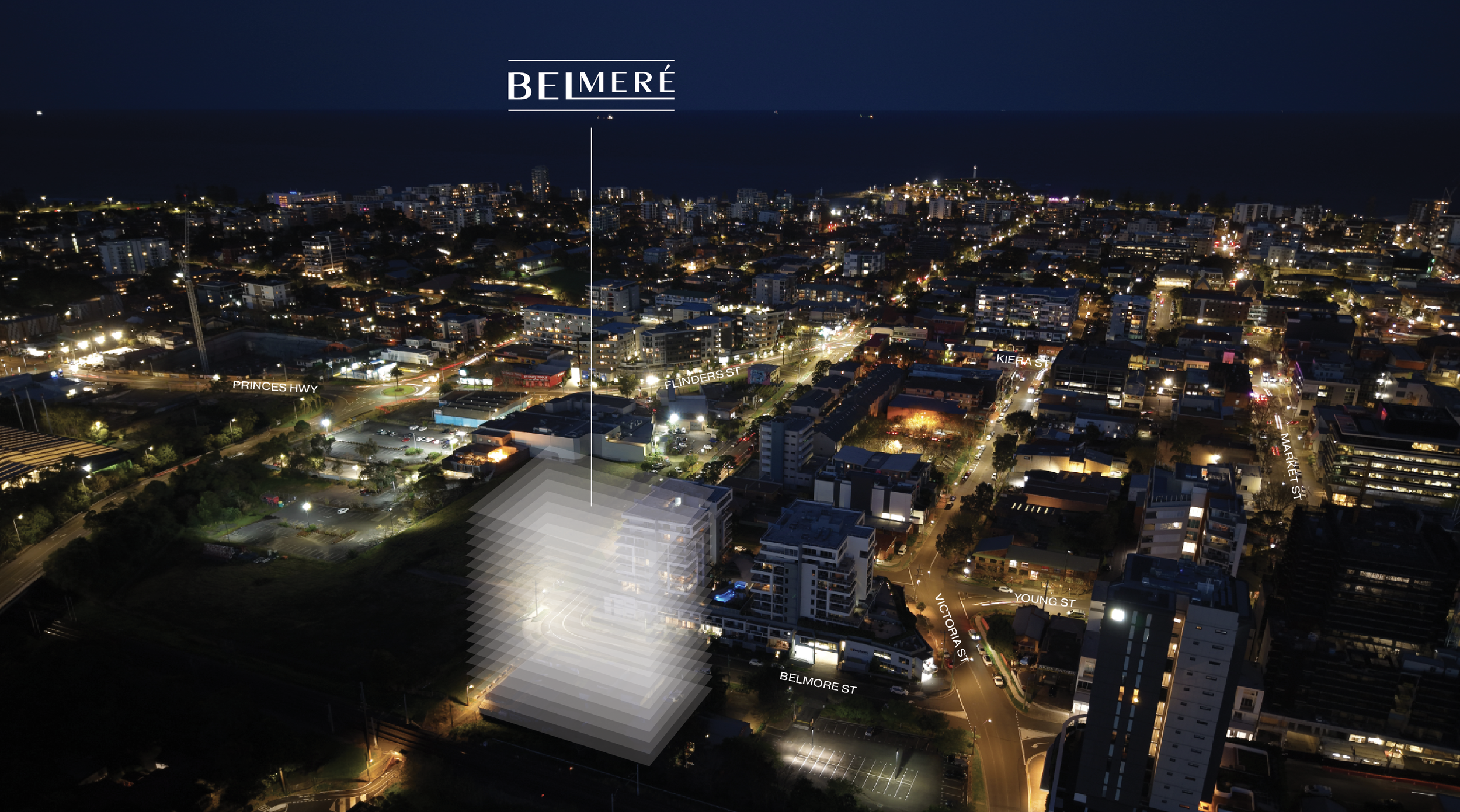 Nighttime aerial view of a city with illuminated streets and buildings. Text labels highlight streets and locations, including Be Miré, Princes Hwy, Flinders St, Kiera St, Victoria St, Young St, Market St, and Belmore St.