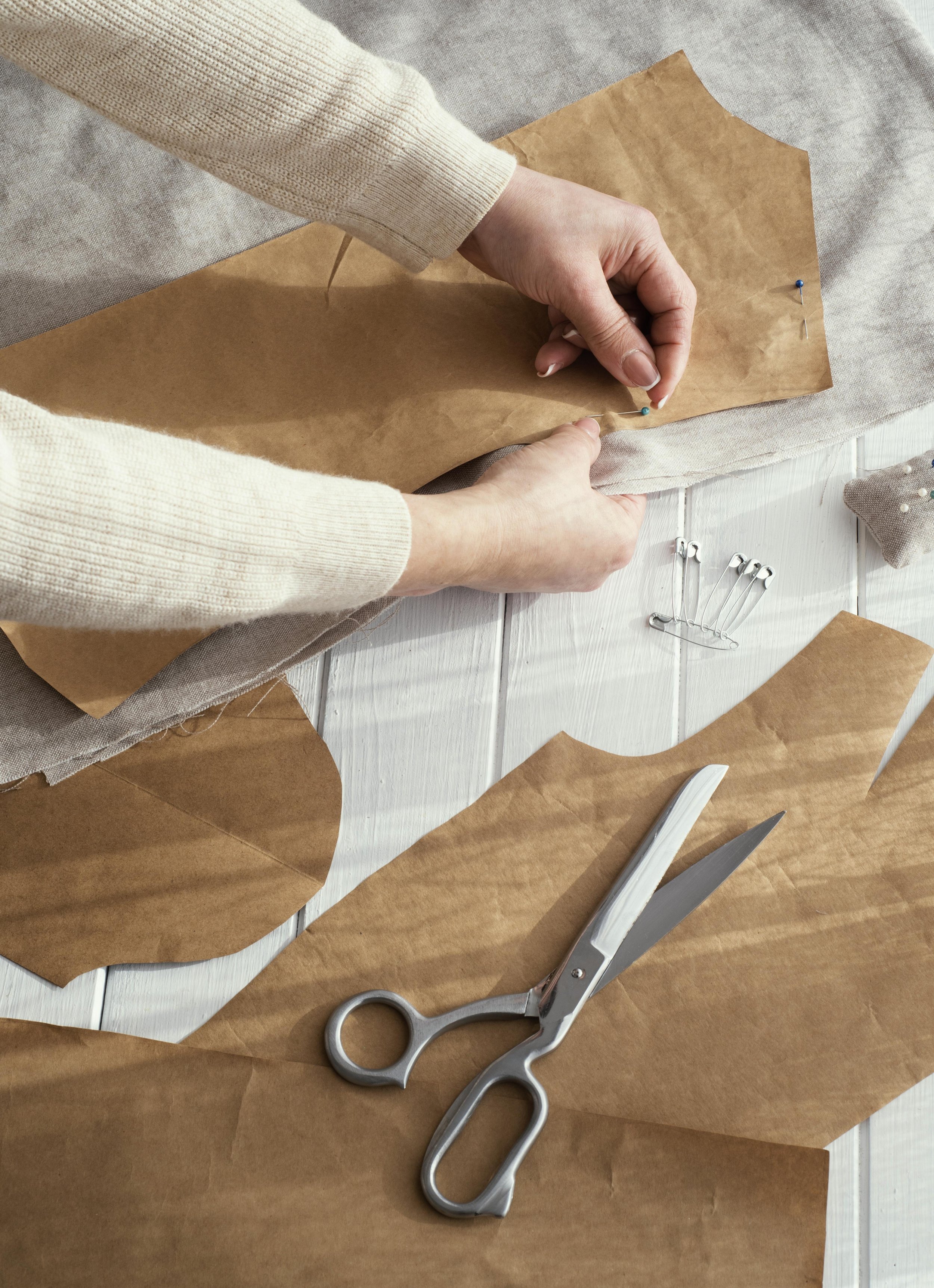 high-angle-seamstress-with-fabrics-scissors.jpg