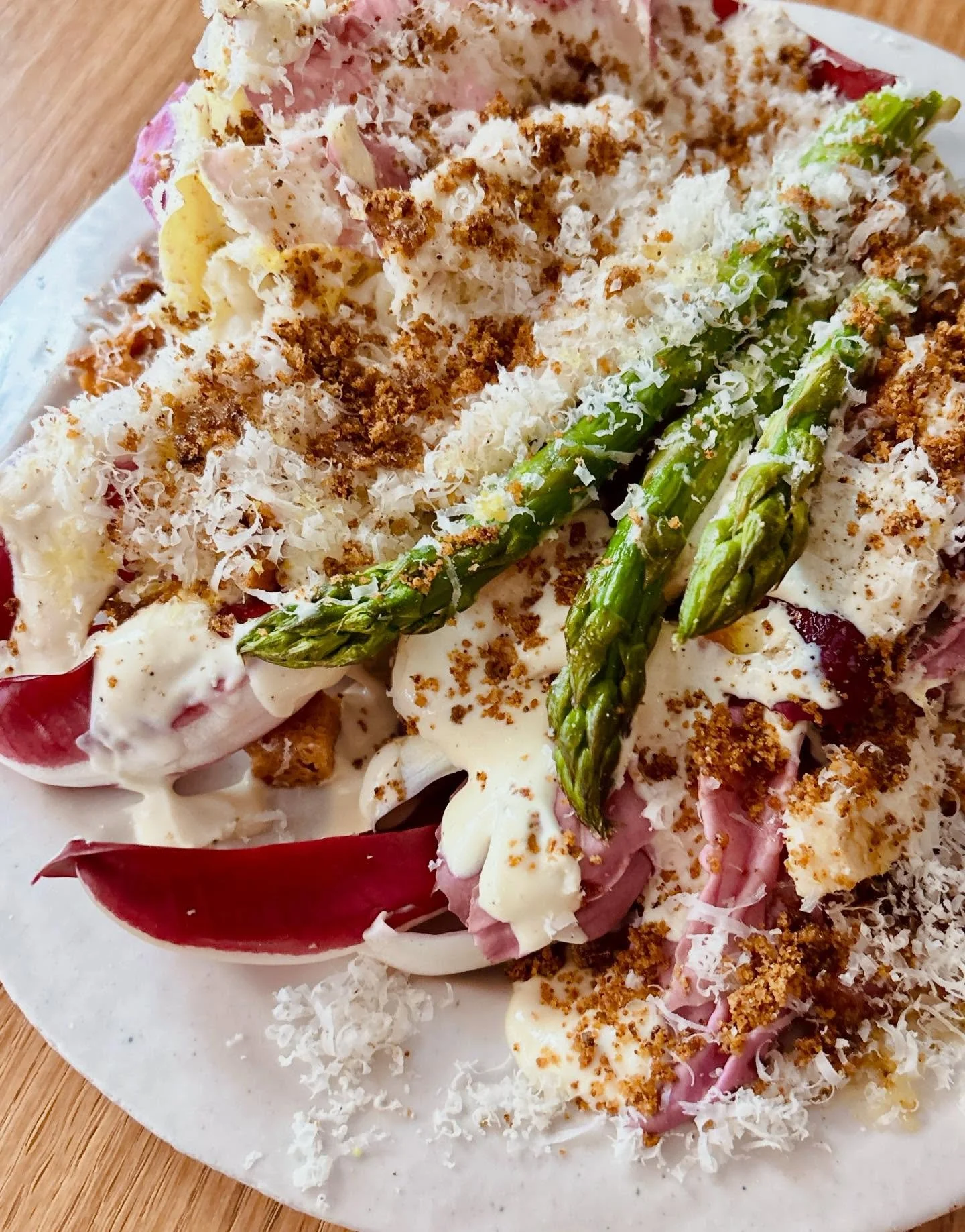 Our CAESAR with castelfranco, radicchio and asparagus (bouches-du-Rh&ocirc;ne), sourdough focaccia croutons, 30 month parmesan, anchovy pangratatto, AND THE CREAMIEST CAESAR SAUCE, with or without poulet fermier