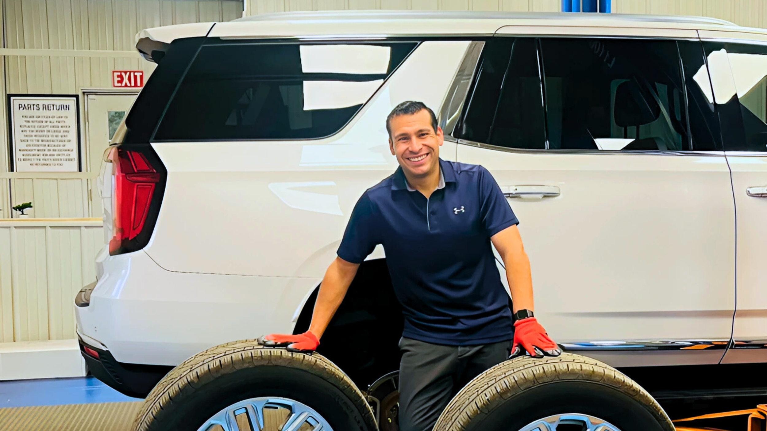 Natan Automotive vehicle mechanic and repair shop owner Jorge doing a tire repair