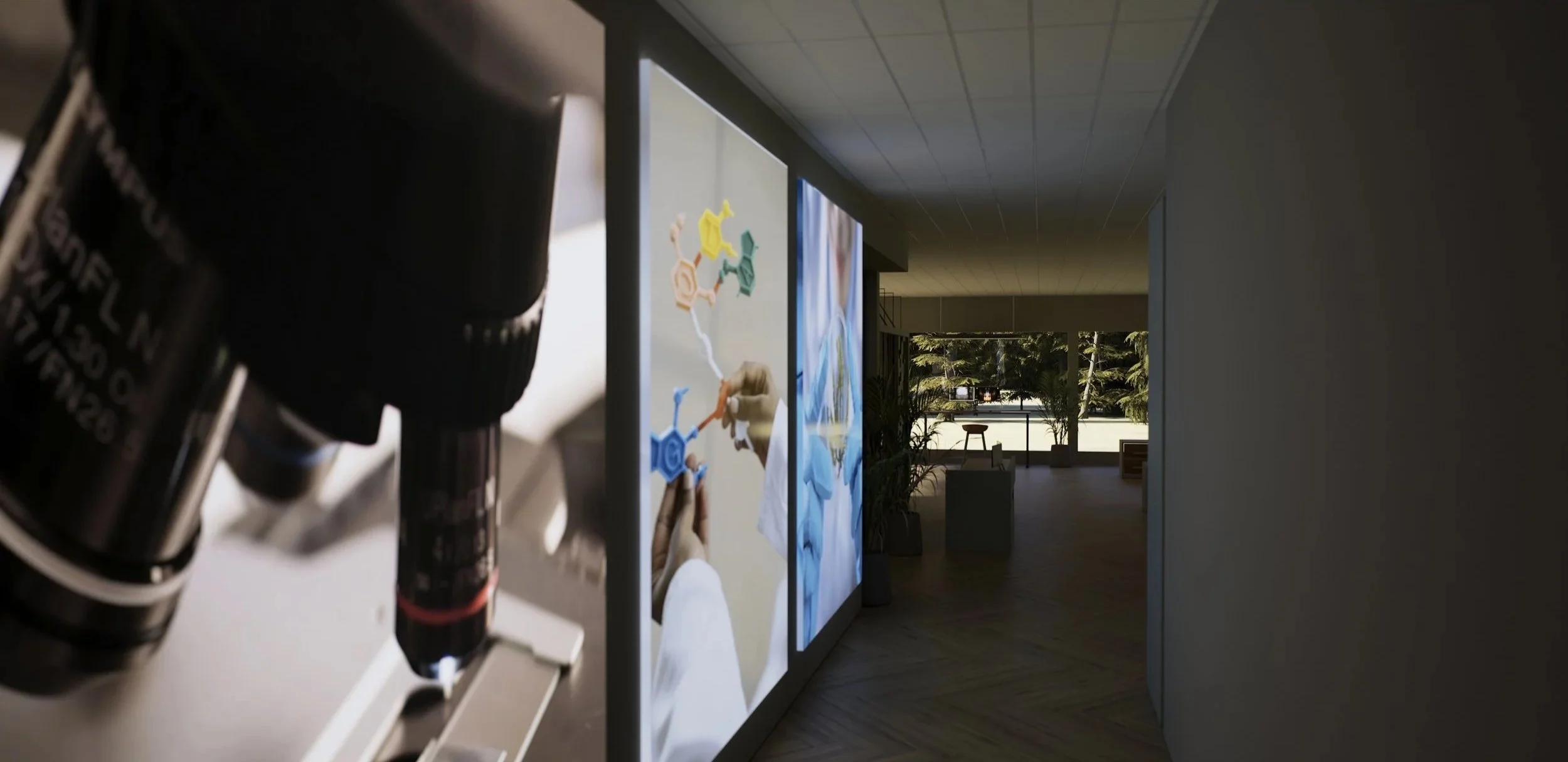 Close-up of a black microscope lens in the foreground, with colorful abstract artwork displayed on illuminated panels along a corridor, leading to a bright room with large windows showing trees and outdoor scenery.