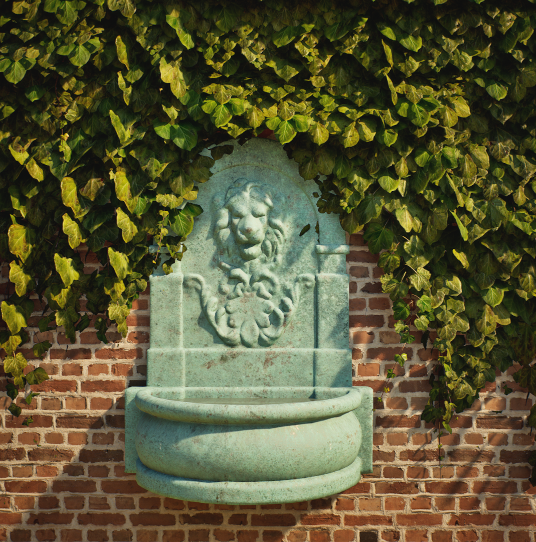 CGI visual. A decorative wall fountain with a lion head sculpture, mounted on a brick wall, partially covered by green ivy. By Frame Seven
