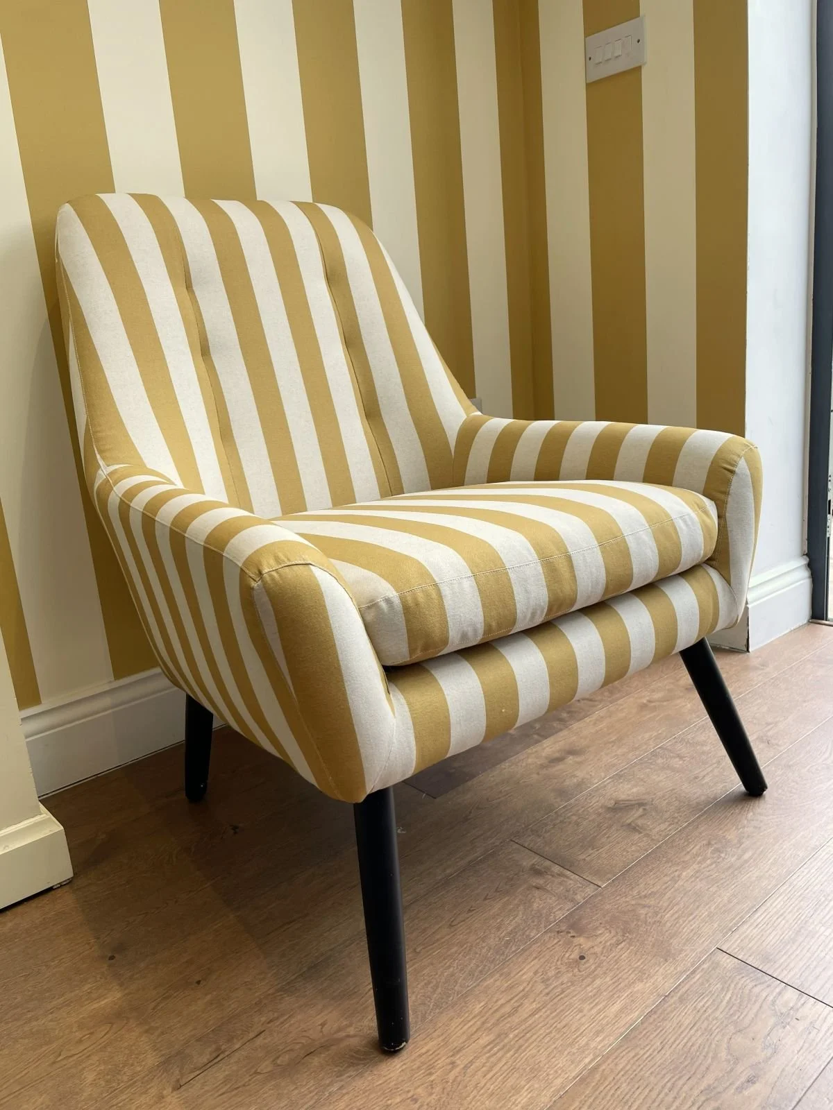 Yellow and white striped armchair