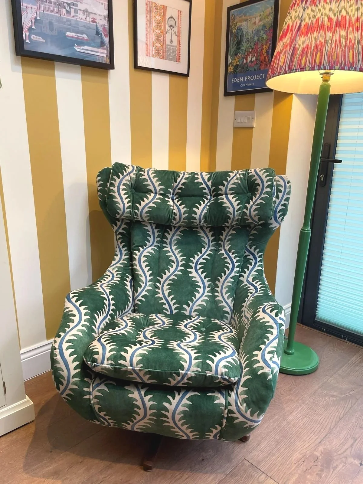 Parker Knoll Statesman chair covered in bright velvet fabric