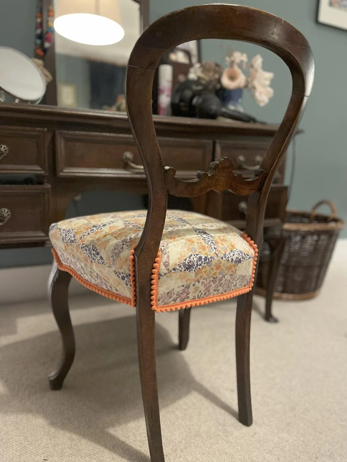 Victorian balloon back chair recovered in vintage floral fabric and contract trim