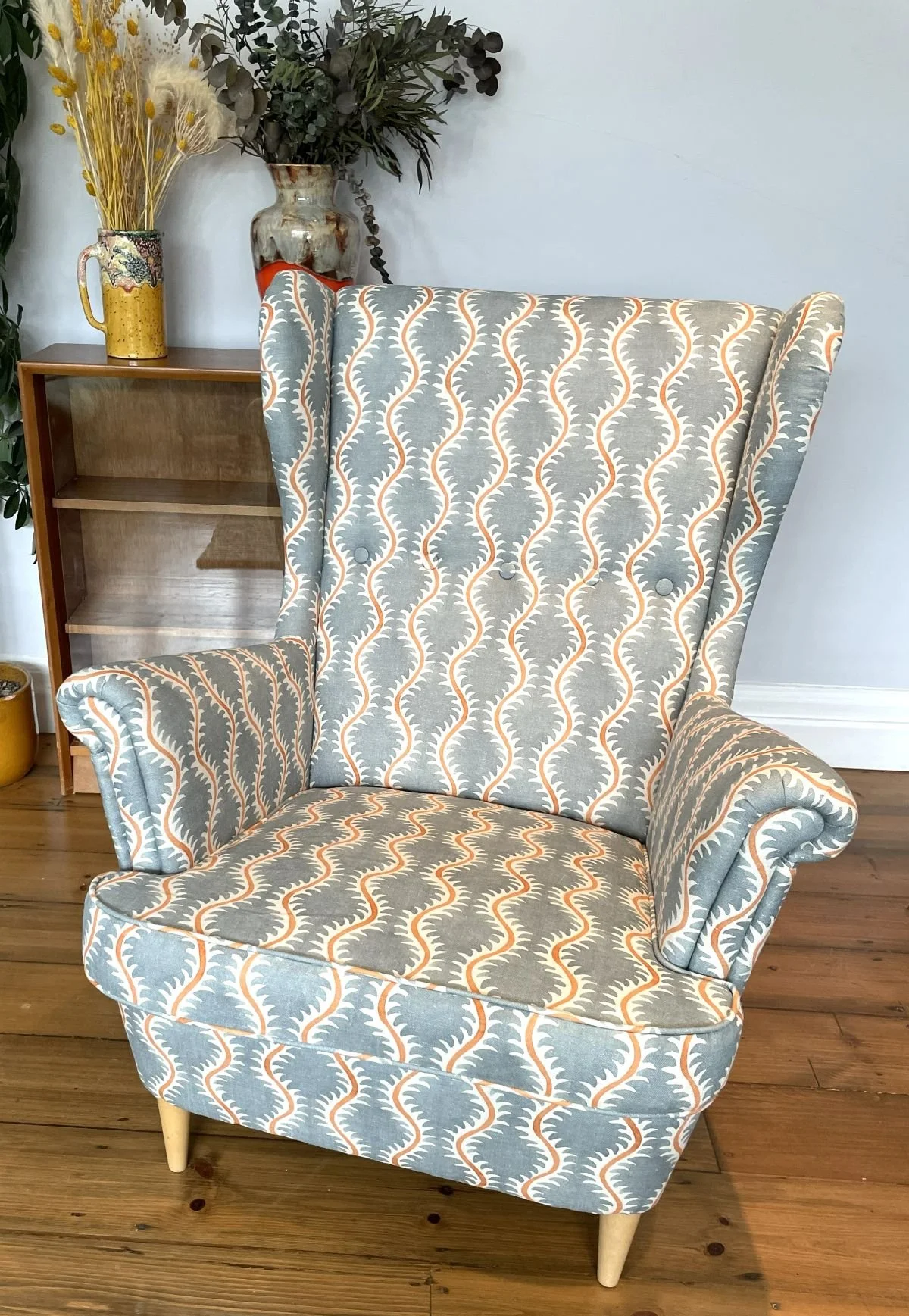 Wingback armchair in pattern fabric