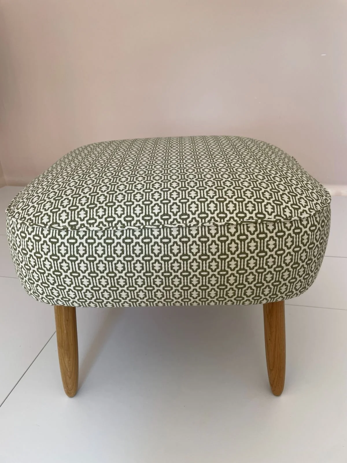 Footstool covered in geometric print