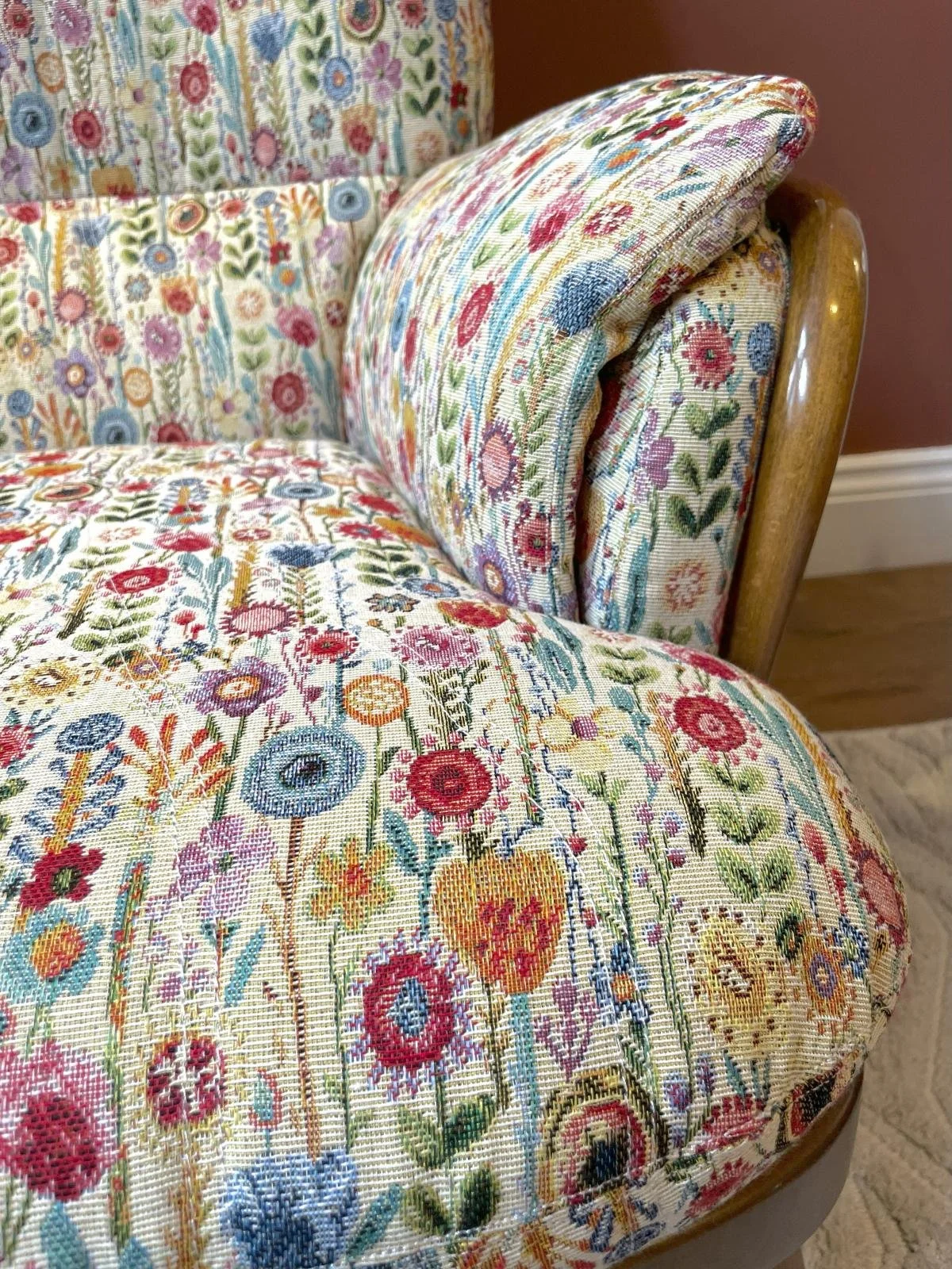 Ercol armchair recovered in floral fabric (close up)