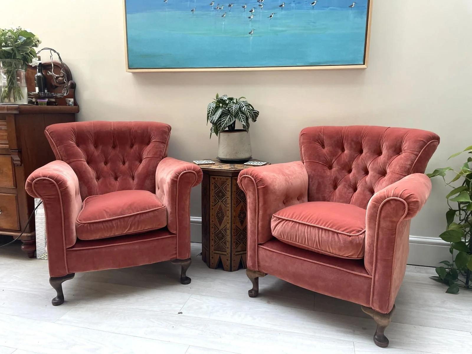 Pair of antique armchairs covered in coral velvet