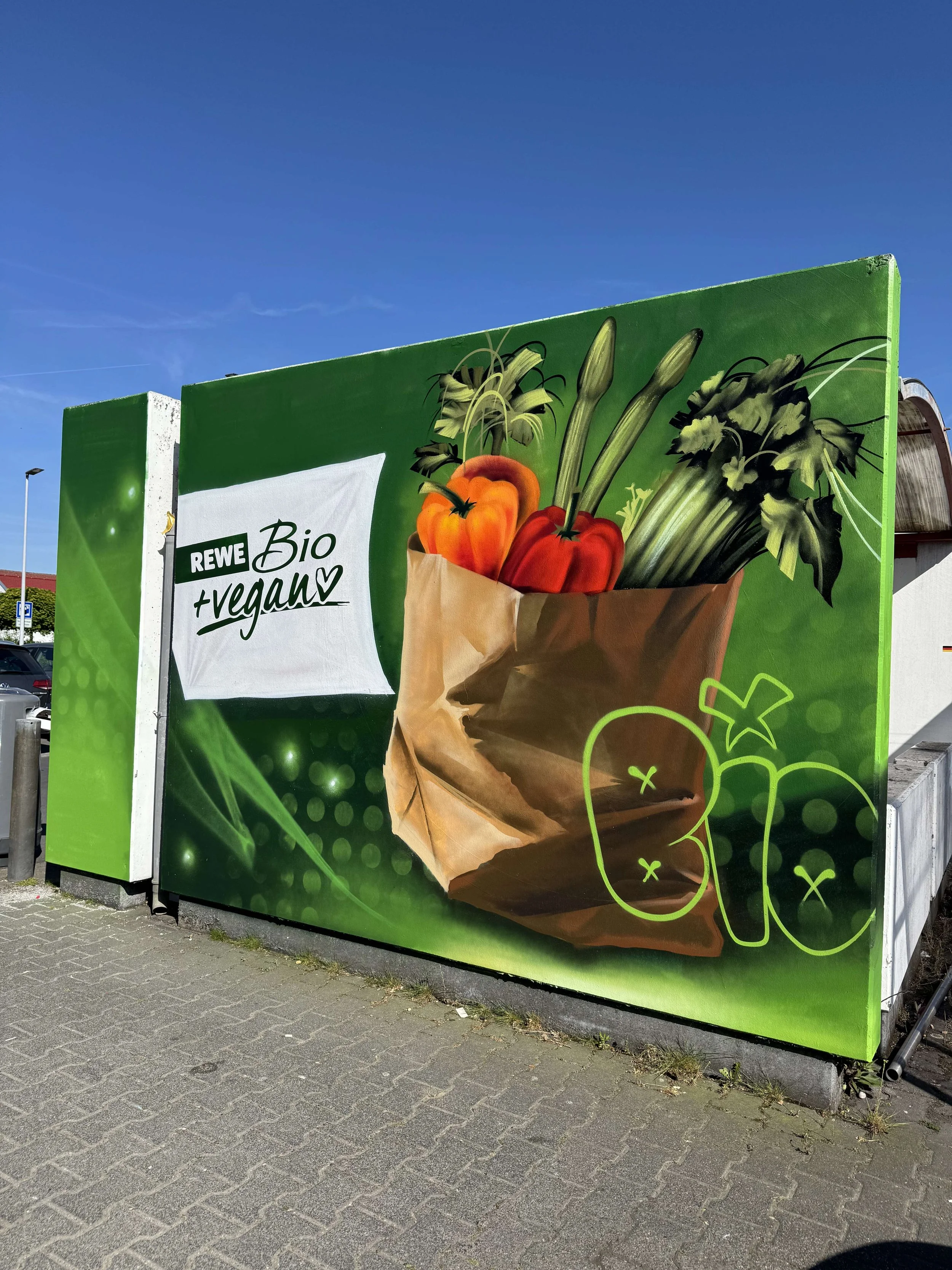der-kunstwerker-wandbild-graffiti-rewe.jpg