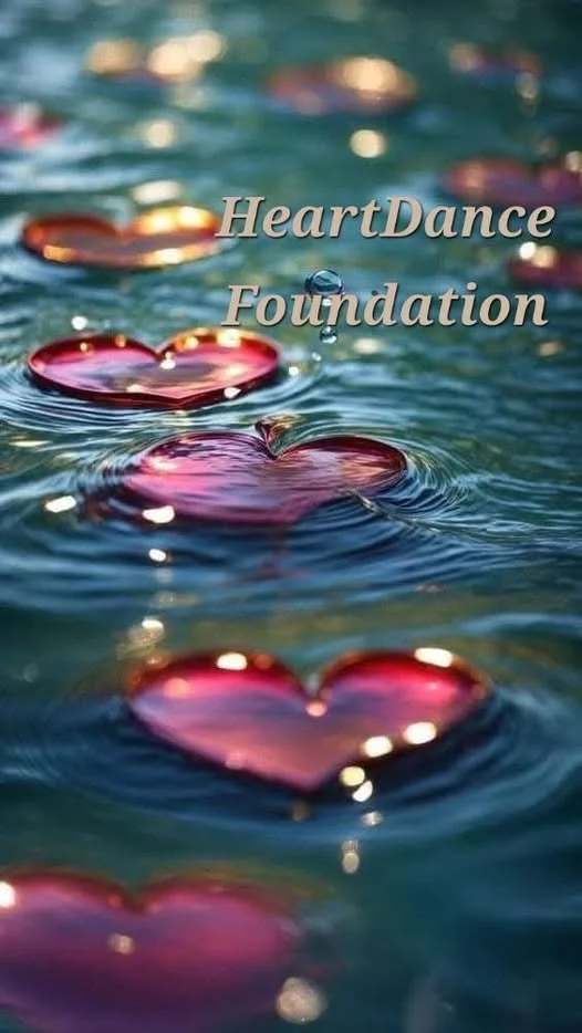 Water with floating pink heart-shaped objects and text that reads 'HeartDance Foundation'.
