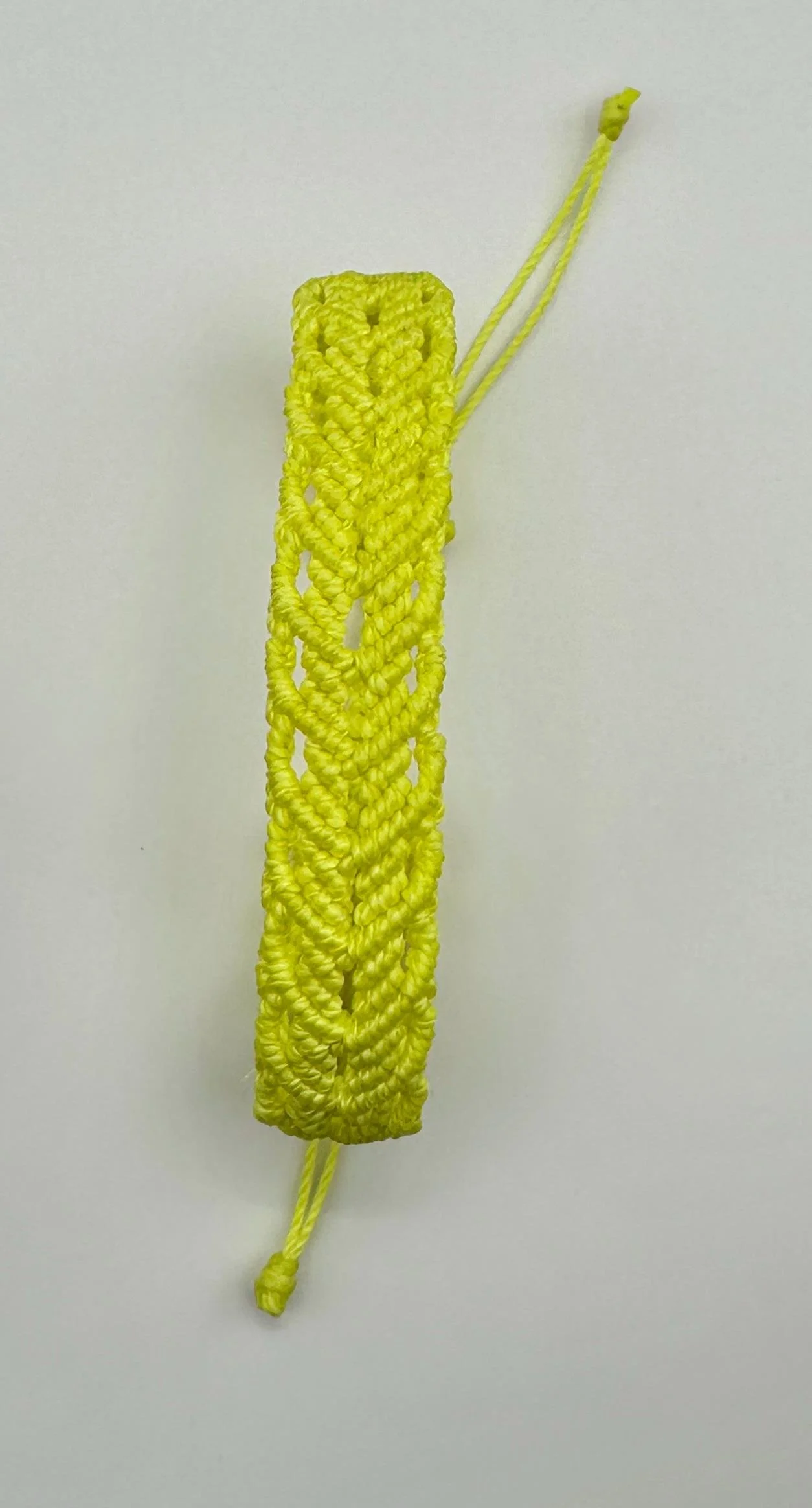close-up of the chevron classic bracelet highlighting the intricate fiber tension and the rhythmic geometric pattern.