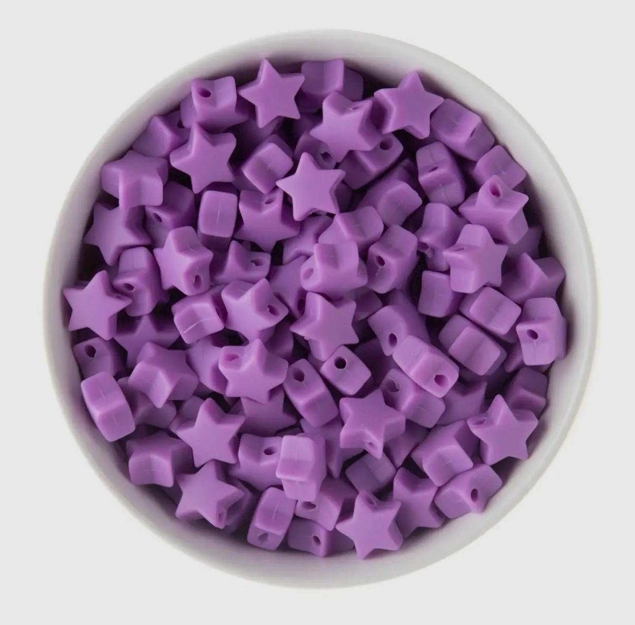 handmade gold star bracelet with a soft silicone focal, showcasing a mix of luxury and playful materials.