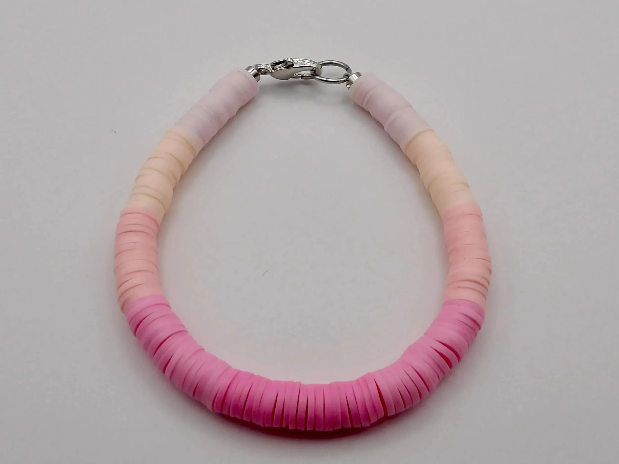 close-up of the organized creative bracelet highlighting the precise color-blocking and the polished metal clasp.