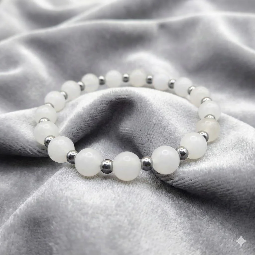an elegant pink and white gemstone anchor set, perfect for layering in a minimalist spring capsule wardrobe.