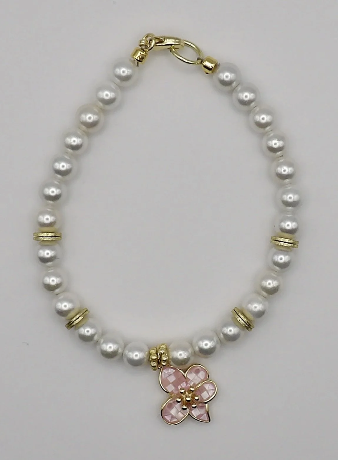 gold and pearl pink hanging charm flower bracelet.