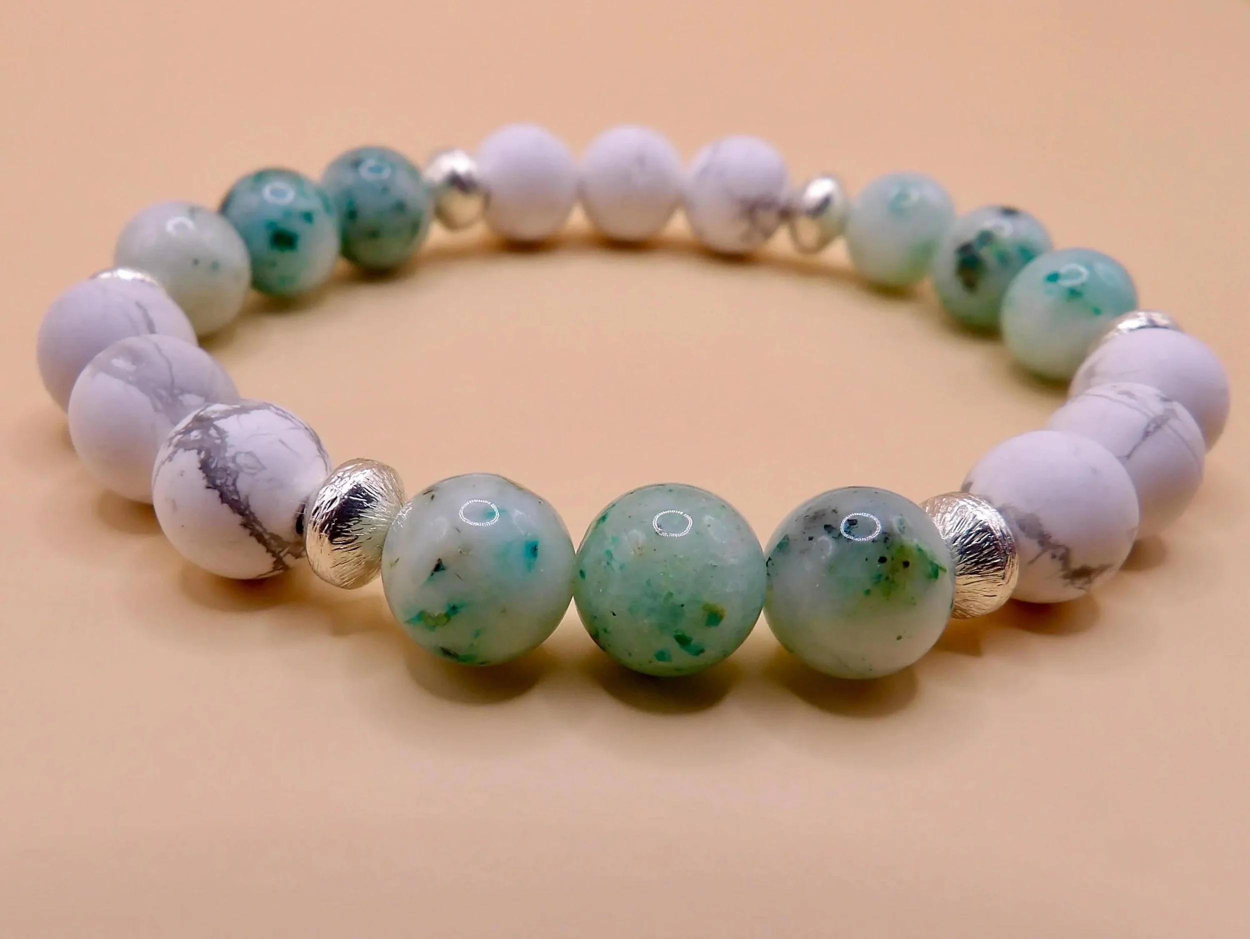 a versatile "coastal-cool" anchor bracelet featuring natural chrysocolla and howlite for a balanced, peaceful aesthetic.