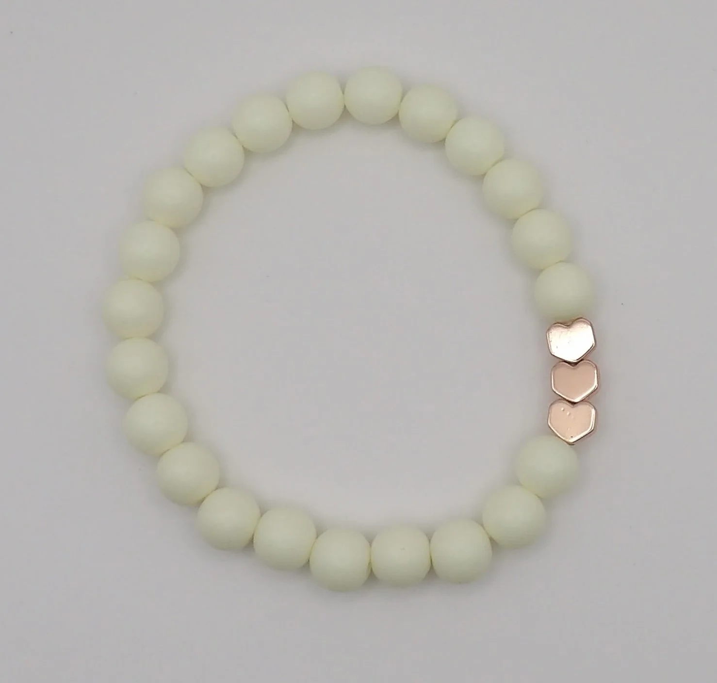 sweet dreams matte heart bracelet in soft vanilla color with a shiny rose gold heart accent bead.
