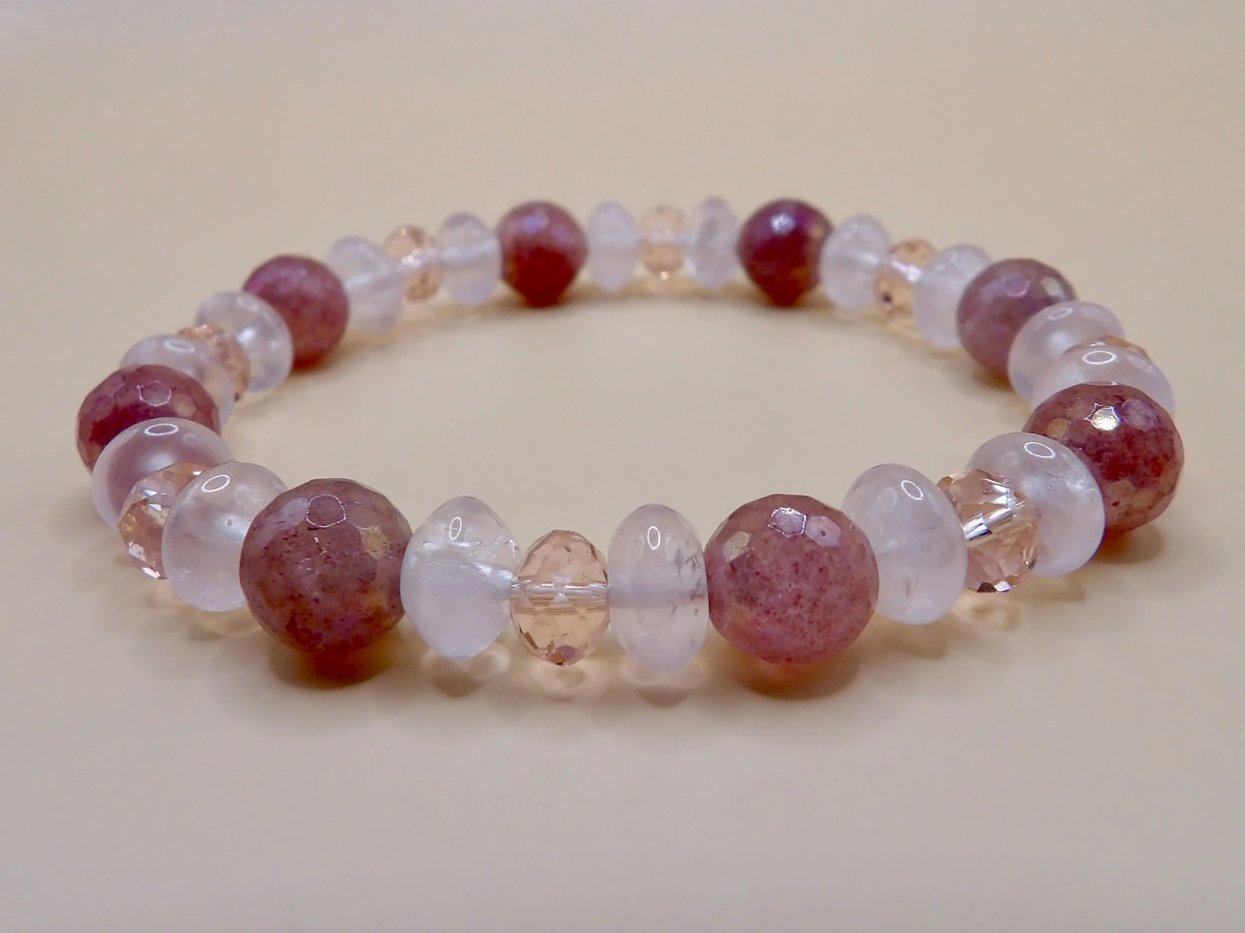 handmade 2-piece pink gemstone stretch bracelet set: one with 14k rose gold & rose quartz, one with mystic strawberry quartz and glass beads.