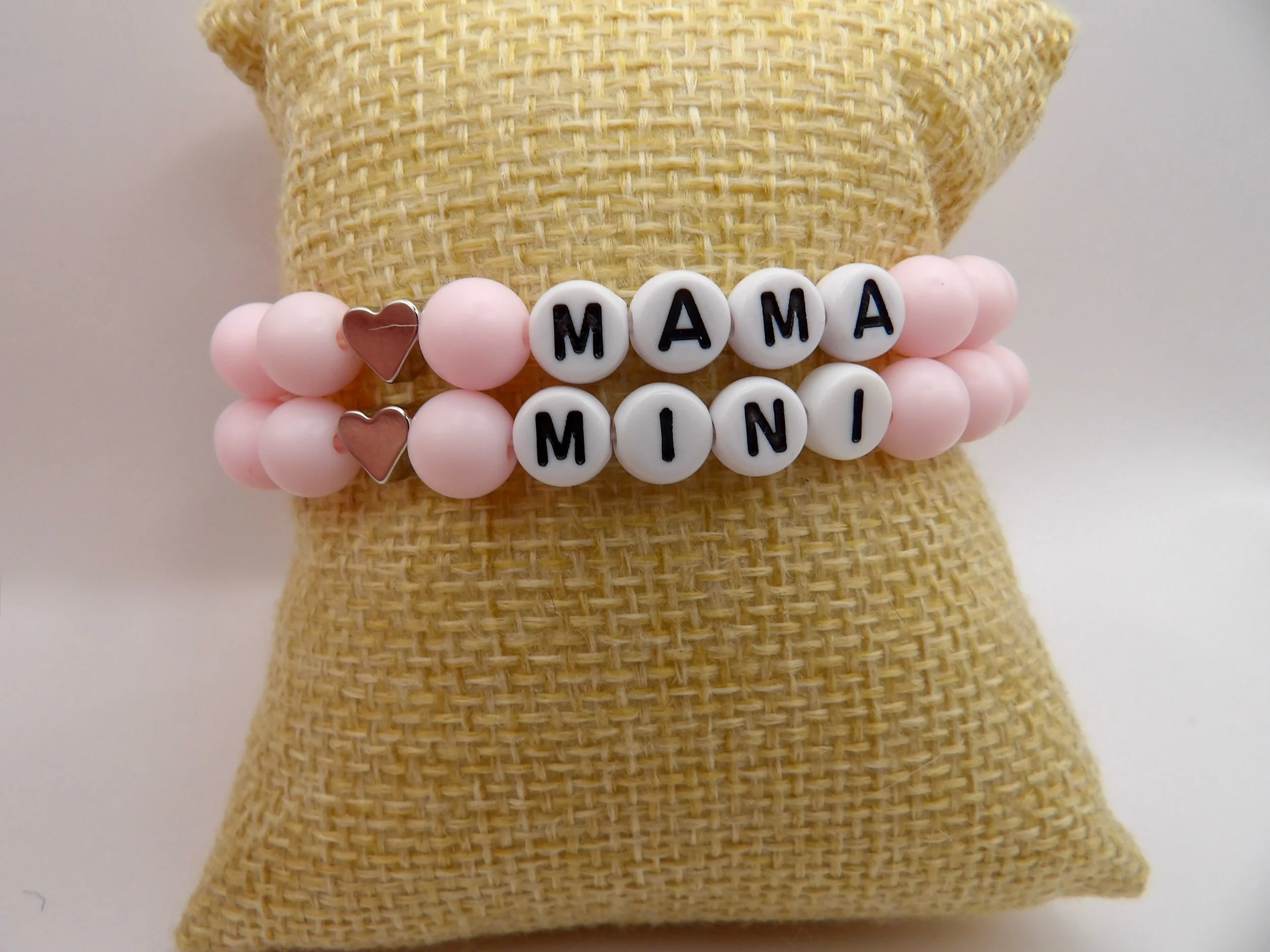 the "mama and mini" pink bracelet set shown in a gift box, perfect for a new mom gift or christmas stocking stuffer.