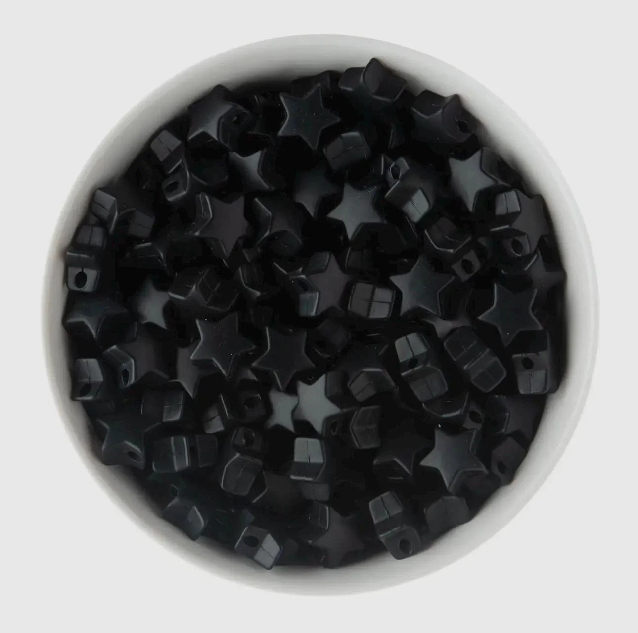 a light and airy jewelry piece featuring high-quality 18k gold plated beads and a playful silicone star charm.